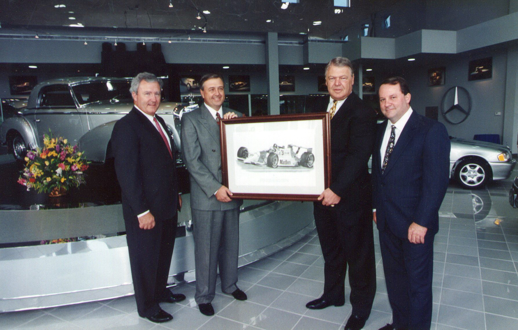 Dan Davis & Bob Snodgrass receive artwork from Mercedes-Benz Regional Office