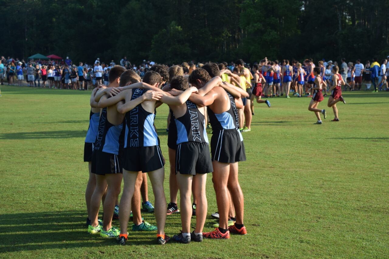 Members of the boys Ponte Vedra High School varsity cross country team joined in a huddle before their events. The team placed sixth in an invitational including more than 20 other high school teams.