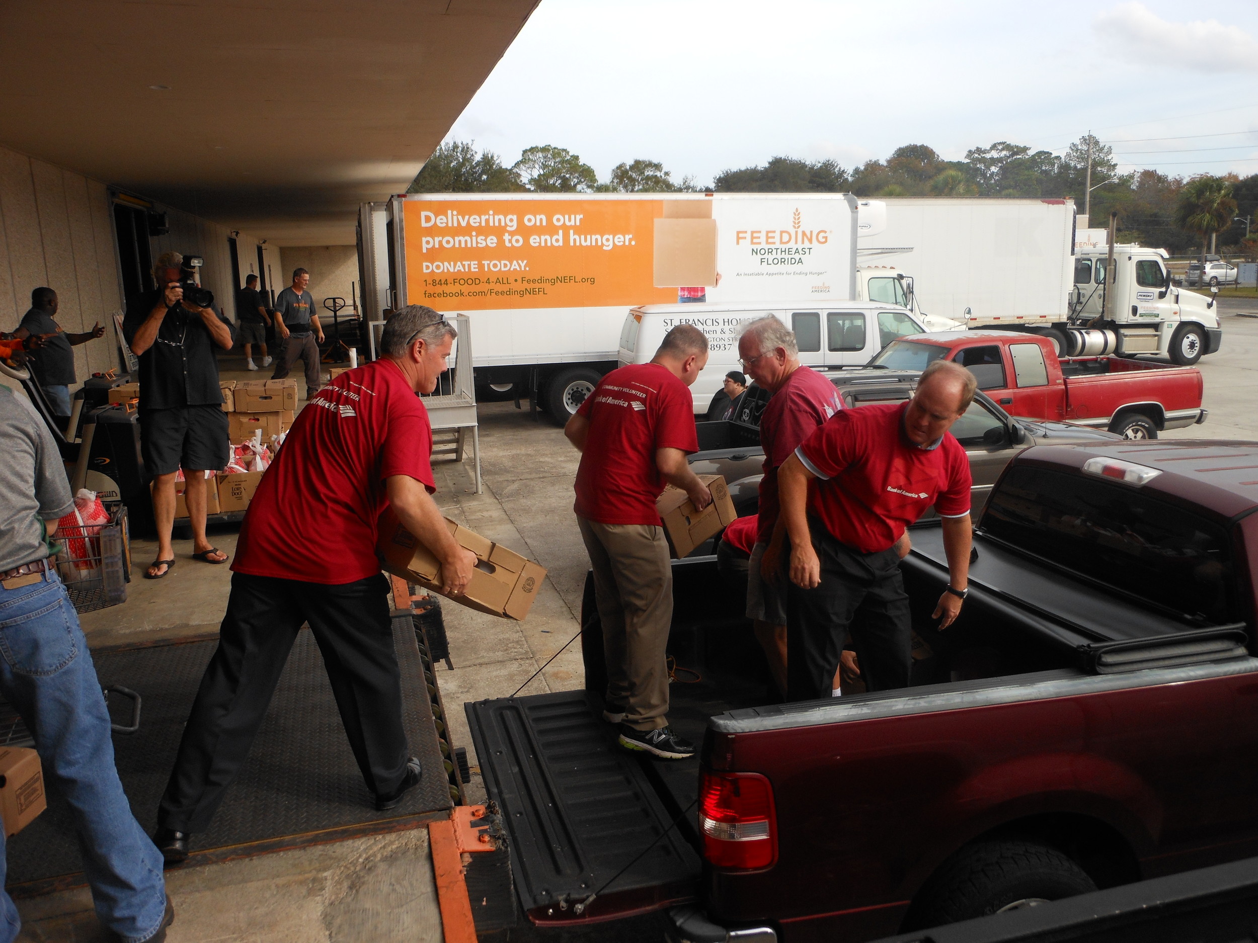 Bank of America volunteers are among thousands who help sort and distribute food at Feeding Northeast Florida's distribution center on Edgewood Avenue