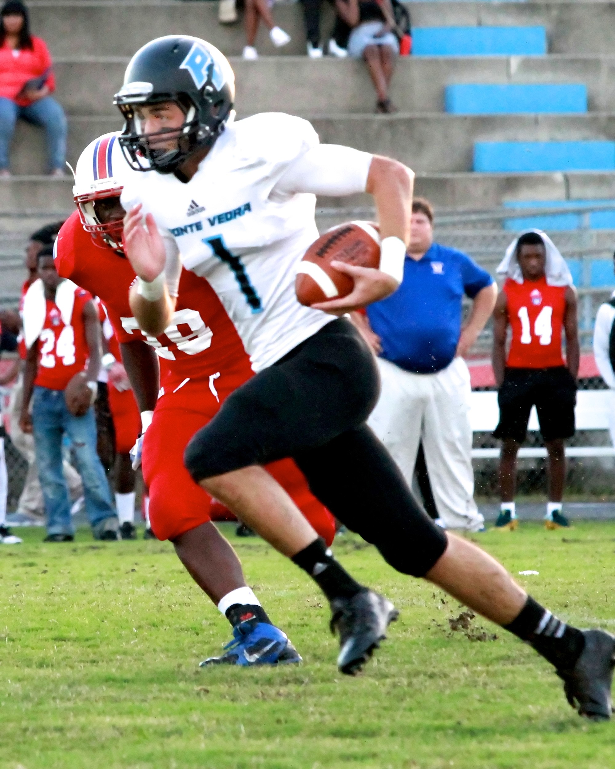 #1 JD Pirris heads for the end zone and the Sharks' first touchdown in 70-0 route of Wolfs