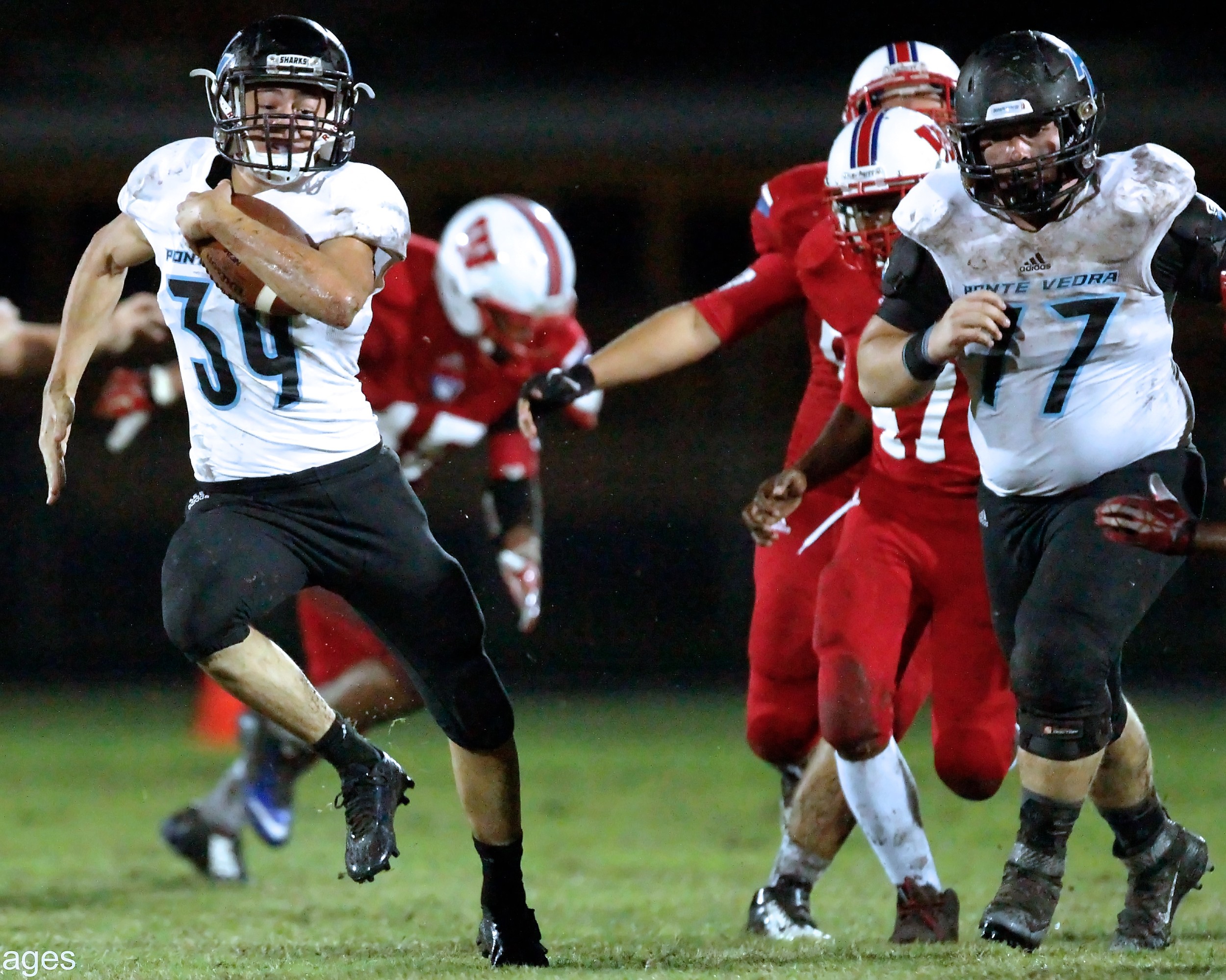 #39 Zach King runs for a Shark touchdown with #77 Taylor Montroy as an escort.