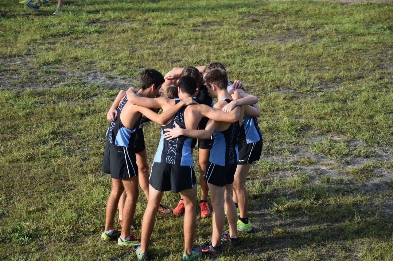 The PVHS JV boys cross country team huddles during the meet this month. The team ultimately finished second overall with many standout performances during the day.