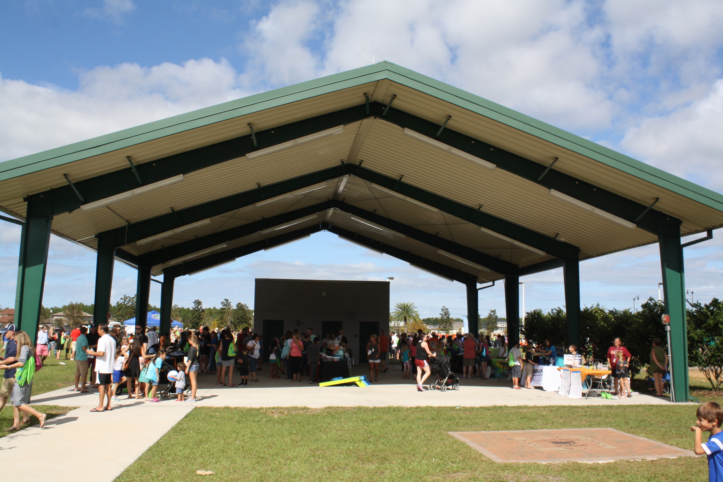 Families could get cool as they browsed gift baskets in the shade of the campus' large outdoor pavilion.