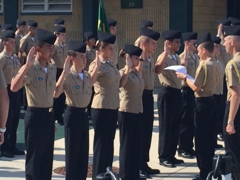 Cadet Company Commander Dane Barber administers the oath to newly promoted cadets during Nease NJROTC’s quarterly promotions & awards ceremony.