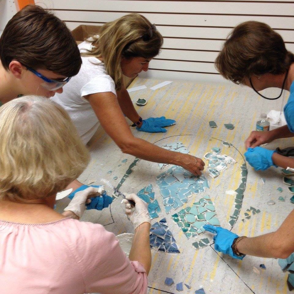 A group works on the new mosaic