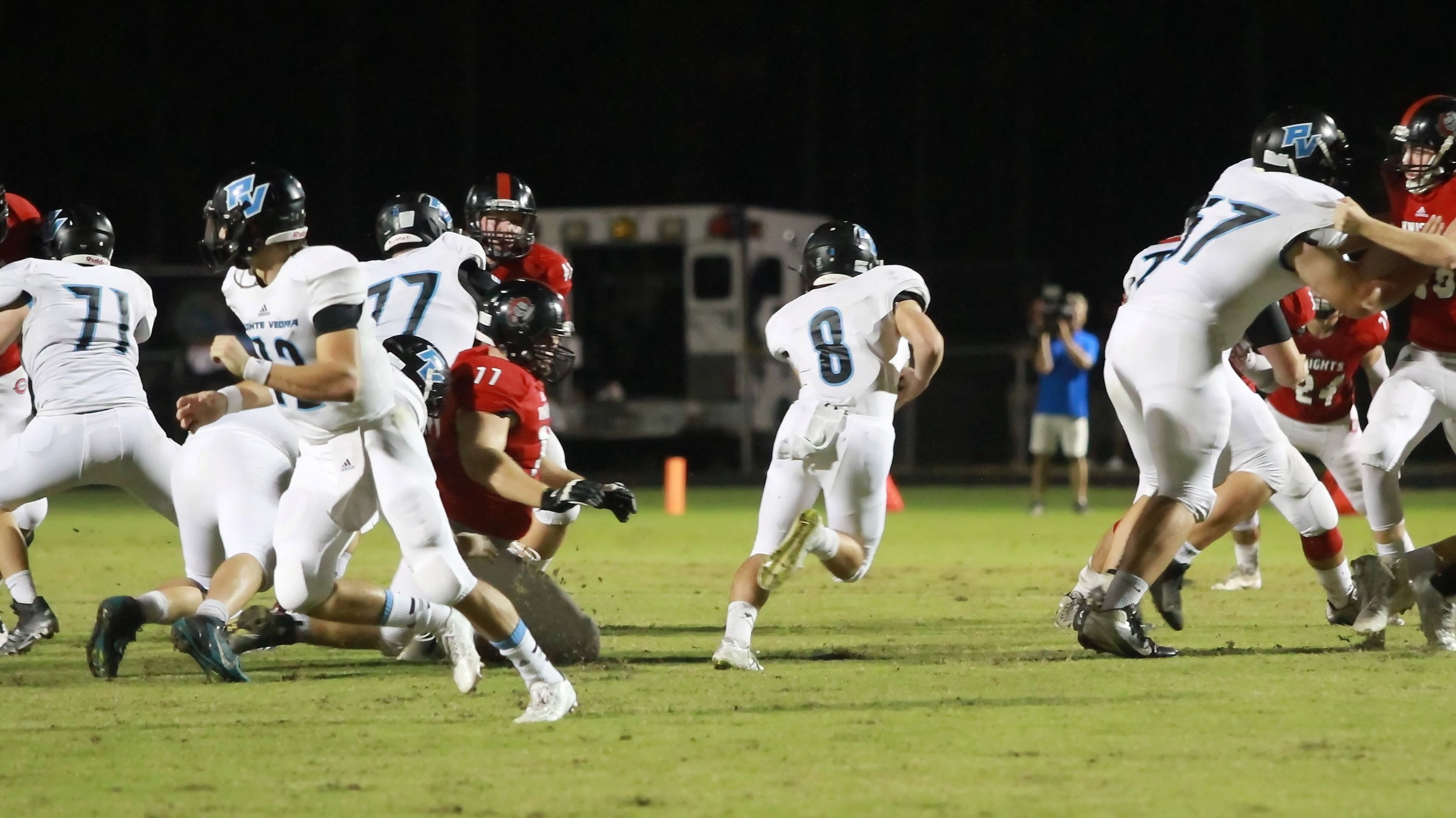 Photos by Chris Norton
#8 Hal Swan of the Sharks runs through a huge hole for good yardage against Creekside