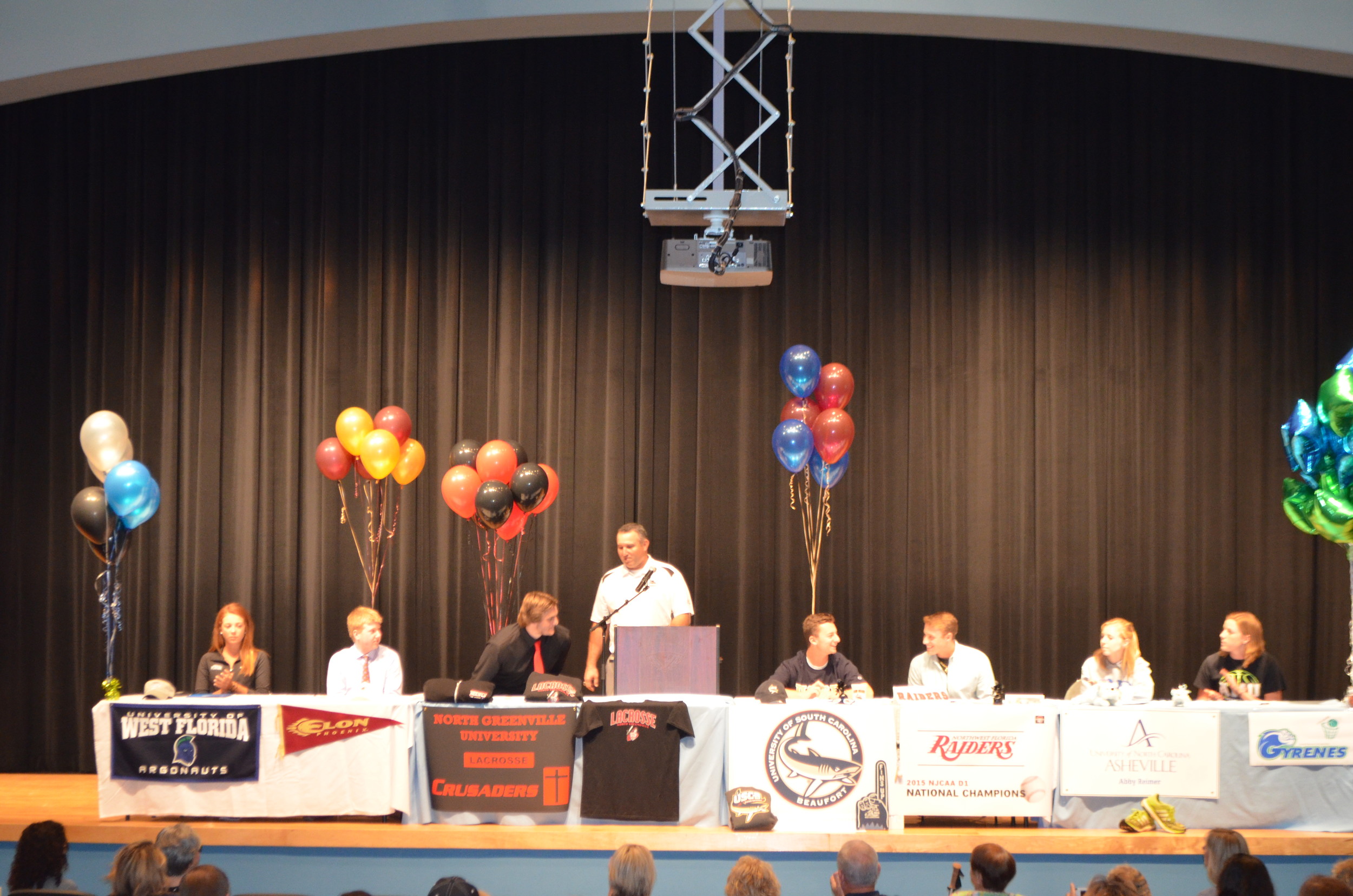Pictured from left to right are Hannah Berman (golf, University of West Florida), Logan Membrino (golf, Elon College), Greg Celani (lacrosse, North Greenville College), JD Norris (baseball, University of South Carolina Beaufort), Jack Layrisson (baseball, NW Florida State College), Abby Reimer (cross country, UNC-Ashville) and Erin Landis (basketball, Ava Maria University).