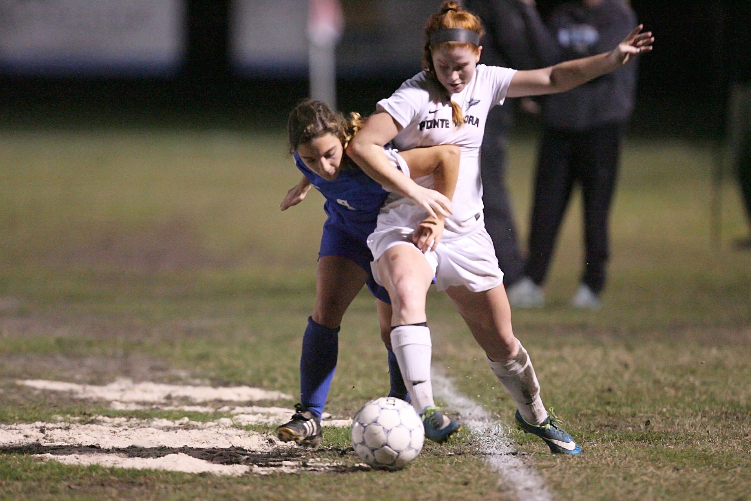 Ponte Vedra’s Marissa Reinker is held by the Clay defender. The Sharks played to a 1-1 tie despite out playing Clay by a wide margin. Clay scored the tying goal in the second half on a controversial penalty shot.