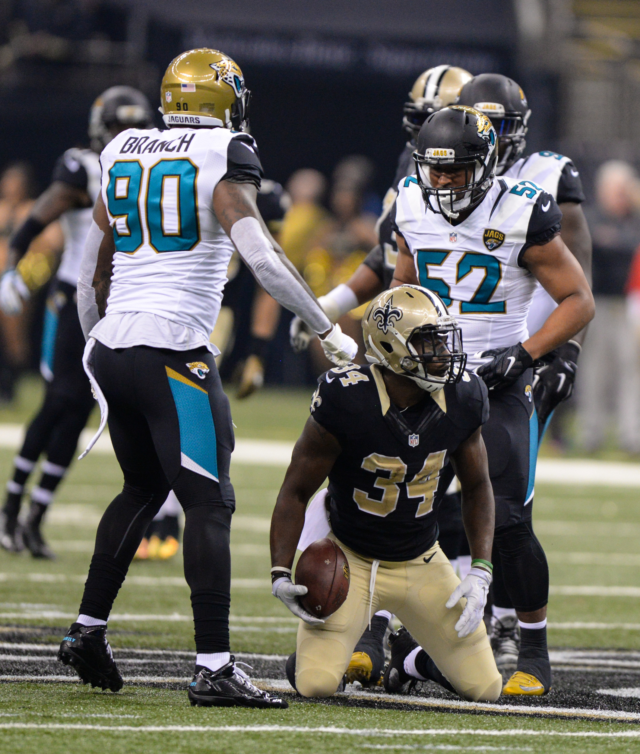Running back Tim Hightower (34) ran for two TDs against Jacksonville. The Jaguars, eliminated from the playoffs, allowed New Orleans’ QB Drew Brees to throw for 412 yards and three scores in the  38-27 loss.