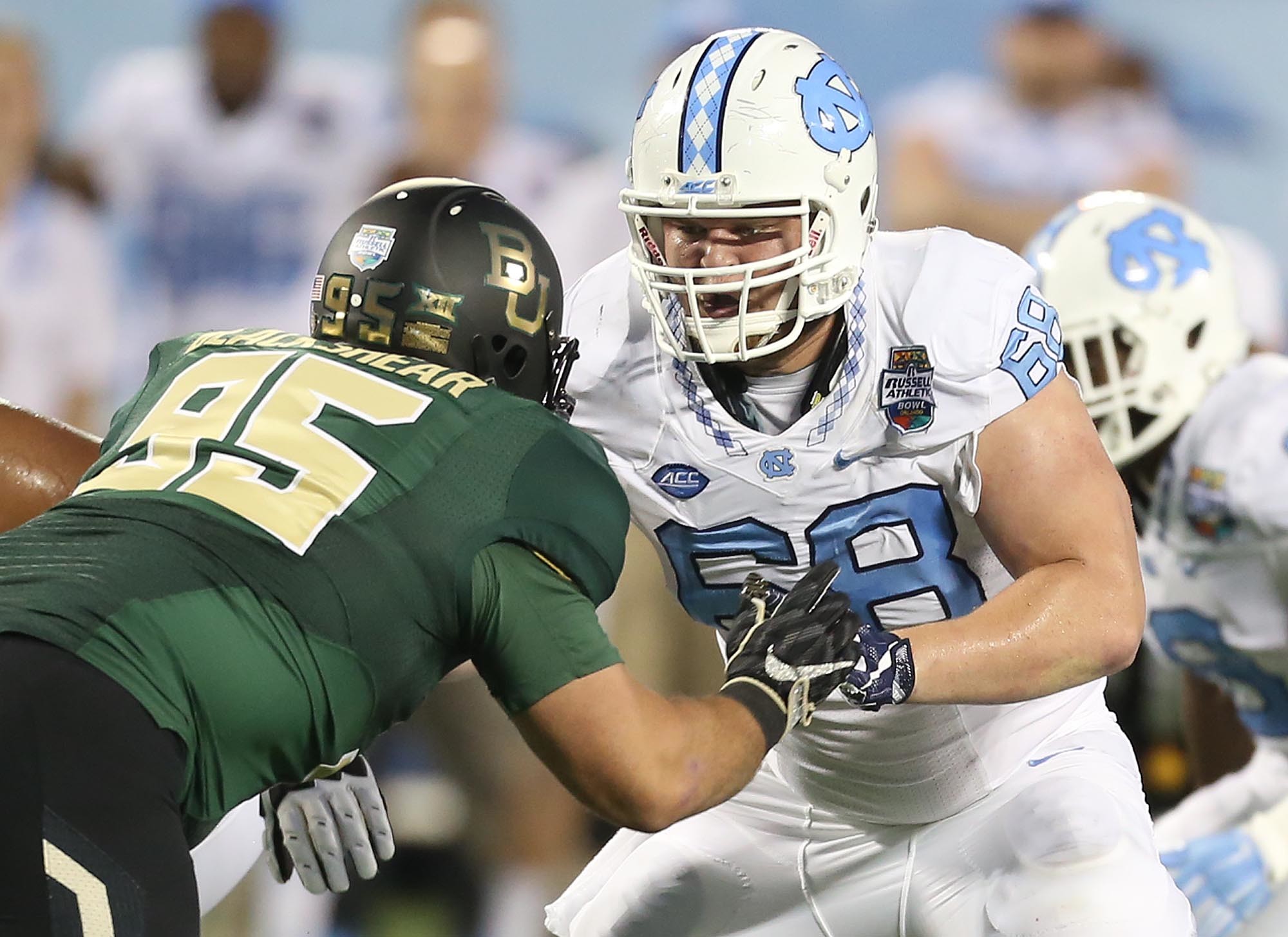 The Russell Athletic Bowl on Orlando saw a couple of high powered offenses in action. Baylor prevailed over North Carolina 49-38 in a record setting performance. Tar Heels center Lucas Crowley (58) played high school ball at Nease.