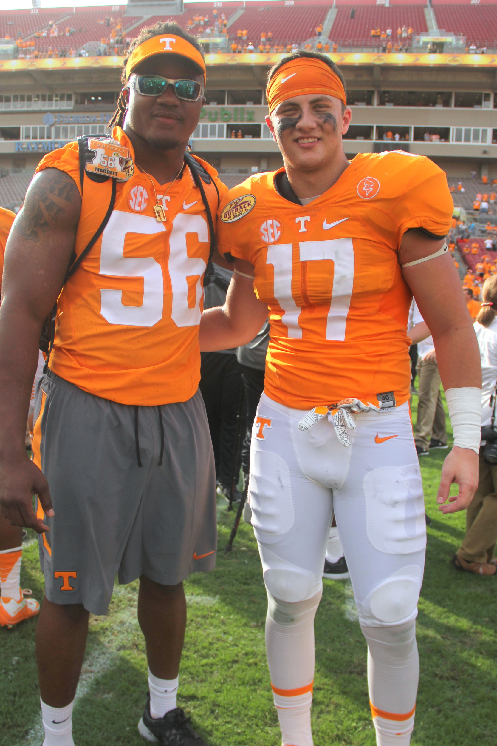 Standout fifth-year senior defensive end/linebacker Curt Maggitt (56), who injured his hip Sept. 12 against Oklahoma (left) and linebacker Dillon Bates (17) of Ponte Vedra Beach after Tennessee’s Outback Bowl win over Northwestern in Tampa.