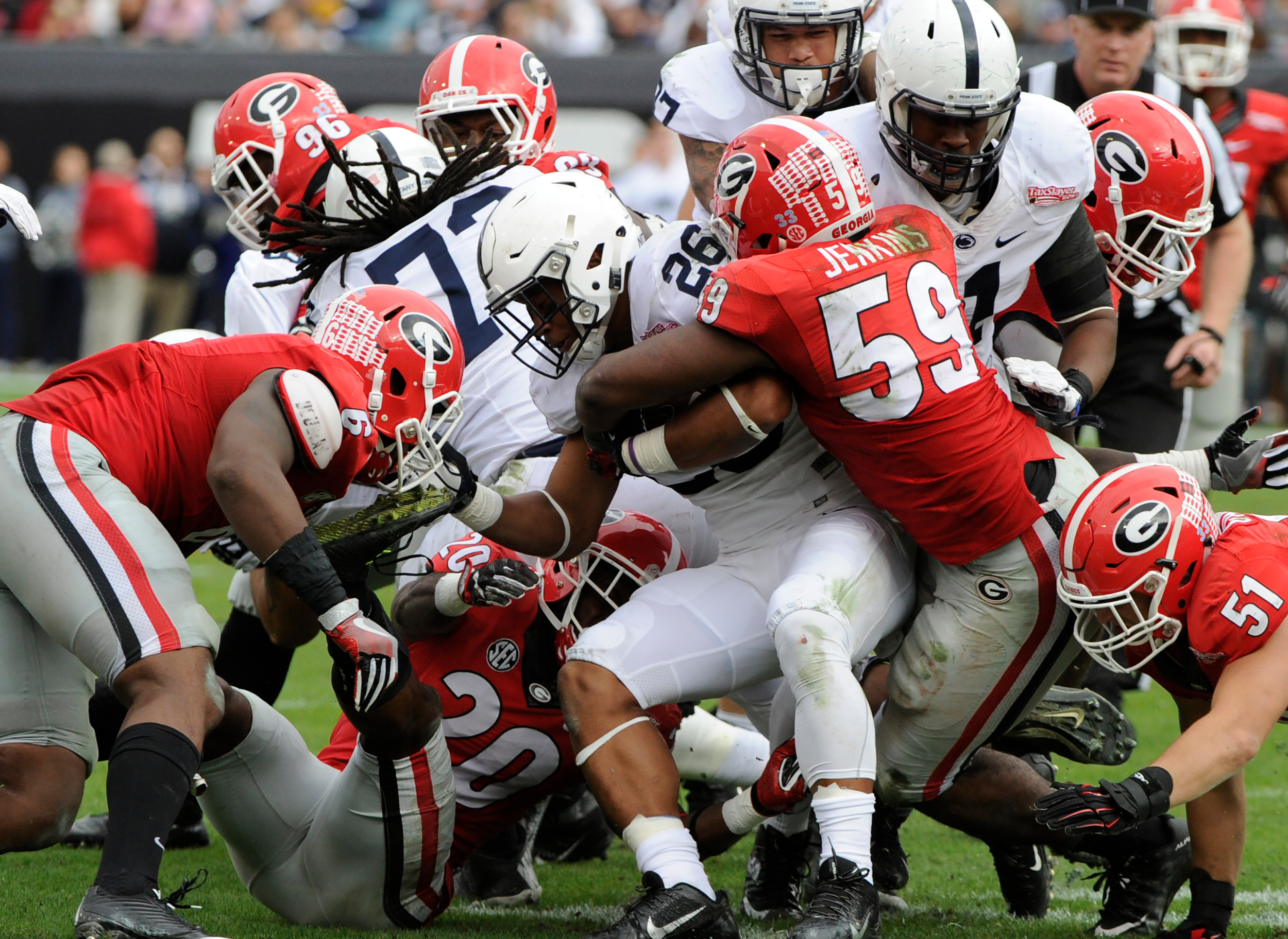 Georgia linebacker Jordan Jenkins (59) makes a tackle during the Bulldogs' game against the Penn State in the TaxSlayer Bowl at EverBank Field.