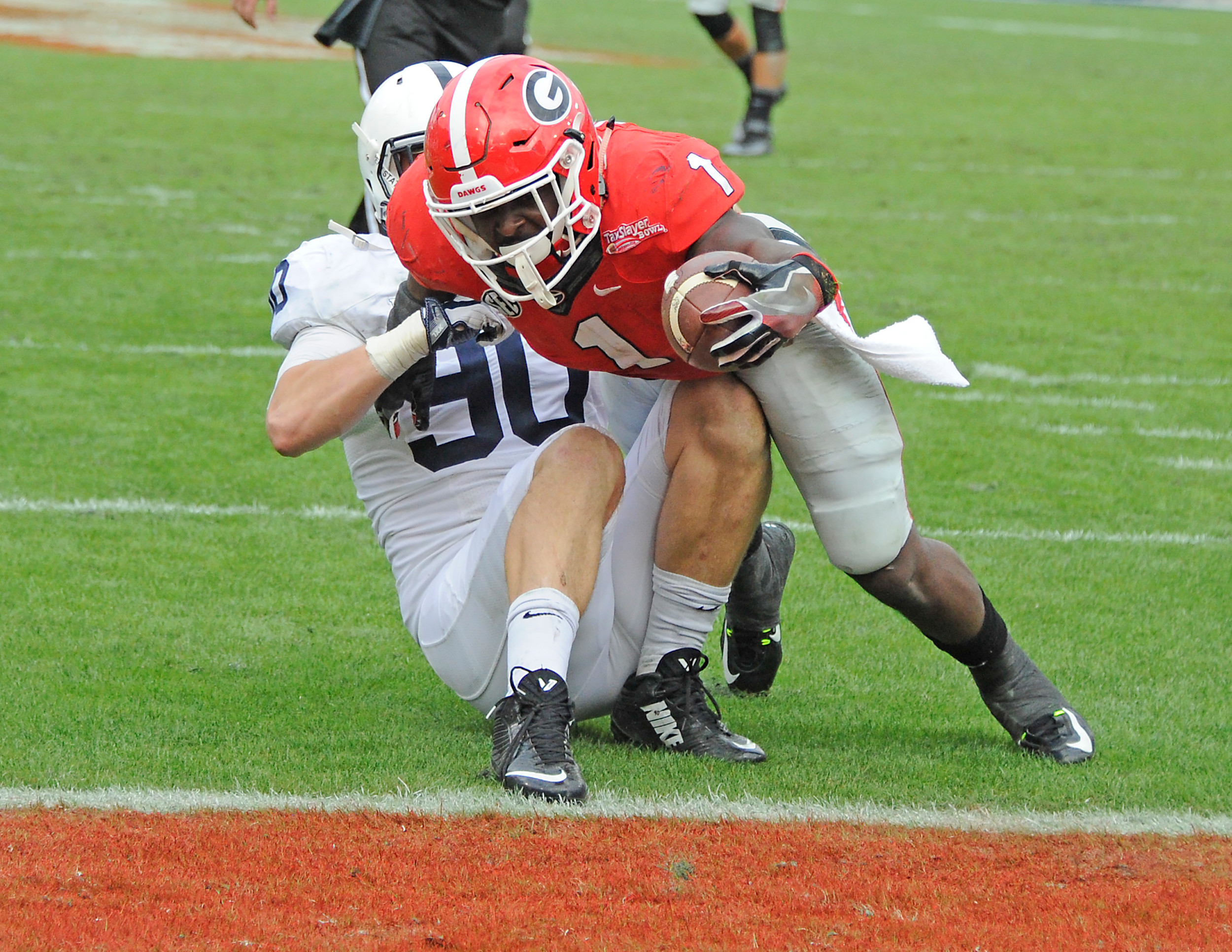 Georgia tailback Sony Michel (1) can't be denied the end zone during the Bulldogs' game against the Nittany Lions in the TaxSlayer Bowl.