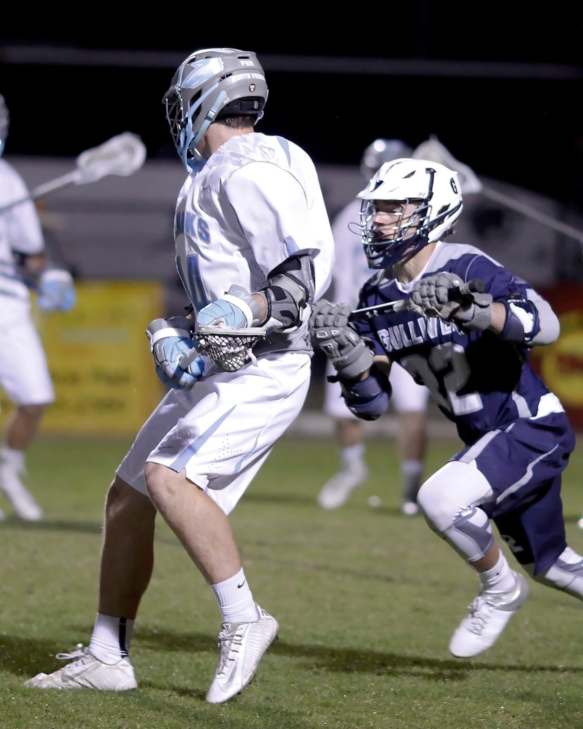 #14 Clay Welch of the Sharks protects the ball from a pressing Gulliver defender