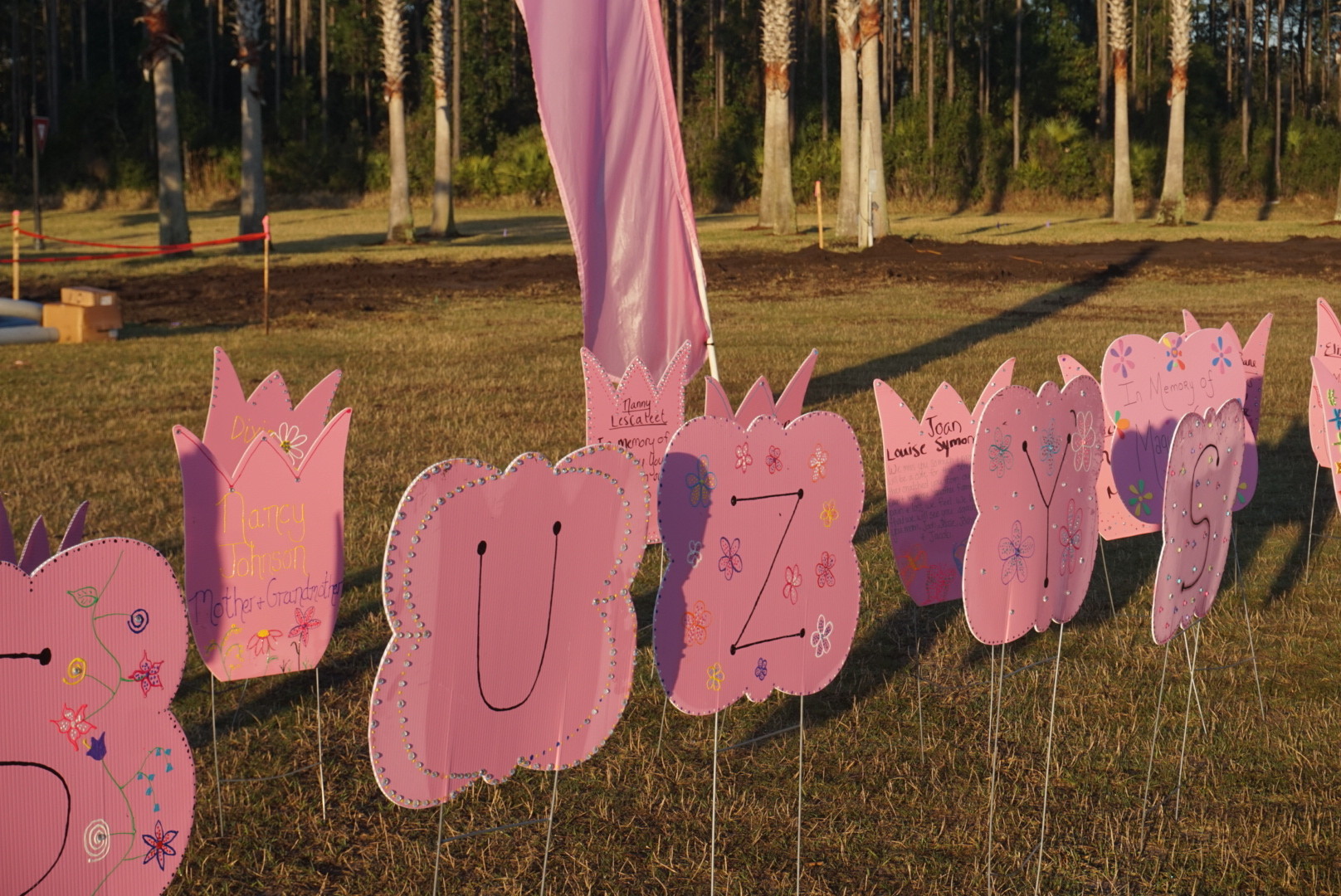 Sweet, handwritten messages dot “Suzy’s Garden,” a tribute to breast cancer patients who fought and are still fighting the disease.