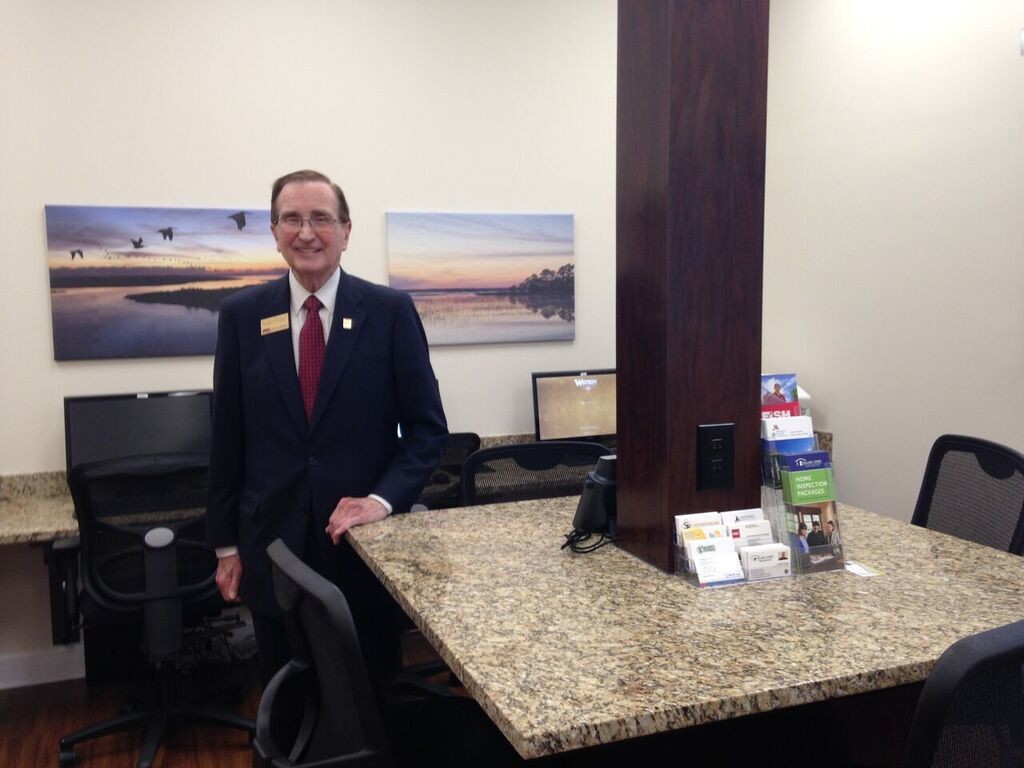 Chairman William Watson displays the Nocatee office’s café/collaborative workspace.