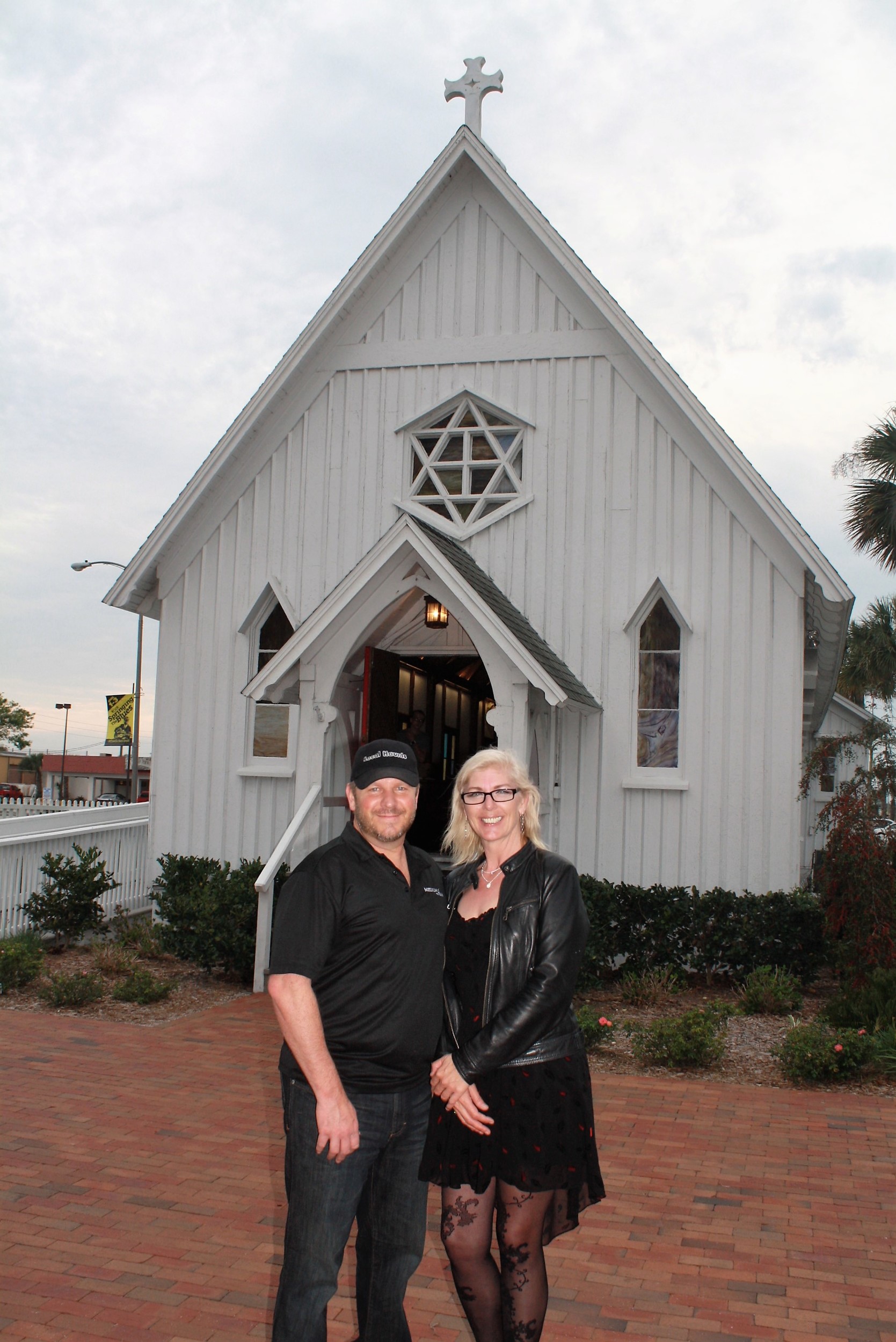 Spiritual medium Pamela Theresa joins “Local Haunts” host Steve Christian outside the Beaches Chapel Museum before the taping of her show “Medium in the Raw.”