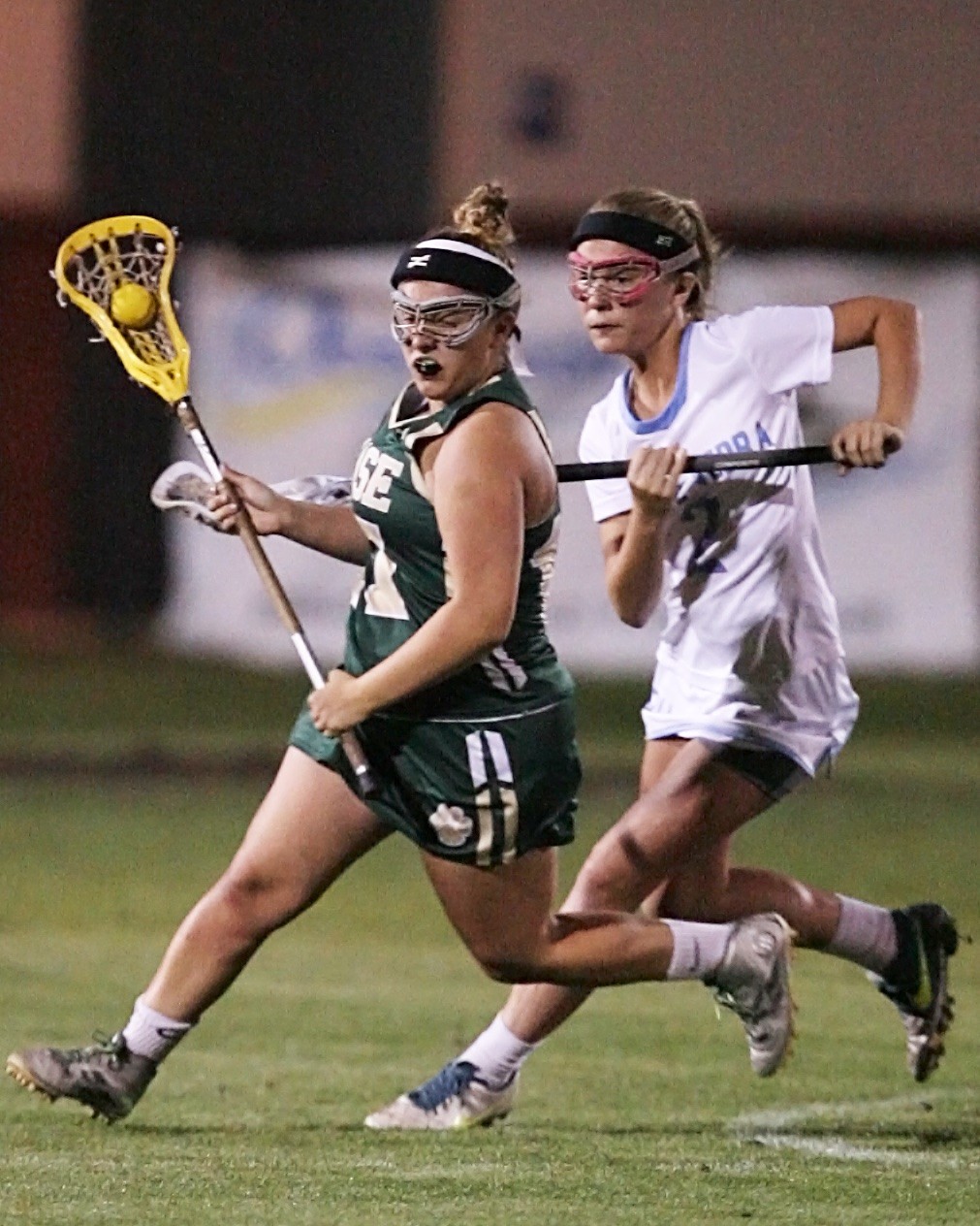 #2 Carleigh Cates of the Sharks defends against the Panther attacker.