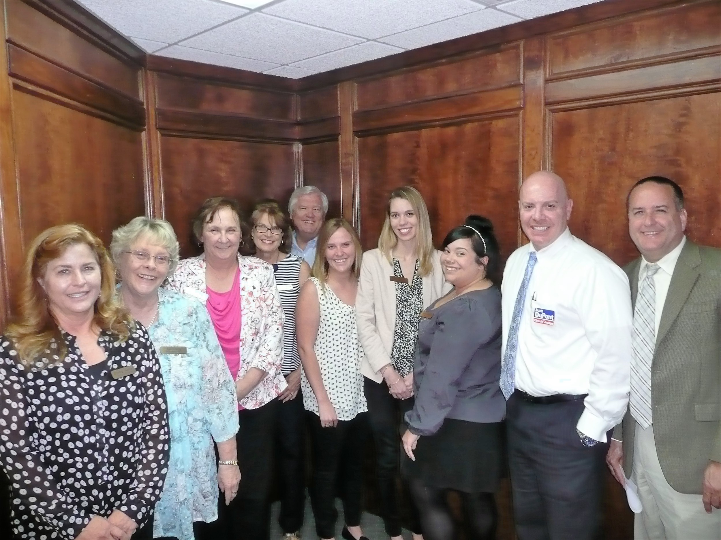 From left: Browning agency staff Shelby Weikel, Terri King, Diane Roche, Cecily Browning, Jim Browning, Taylor Barnard, Regina Morriss and Pavline Savino; Judge Scott DuPont; and Declan Reiley, vice president of economic development for the St. Johns County Chamber of Commerce.