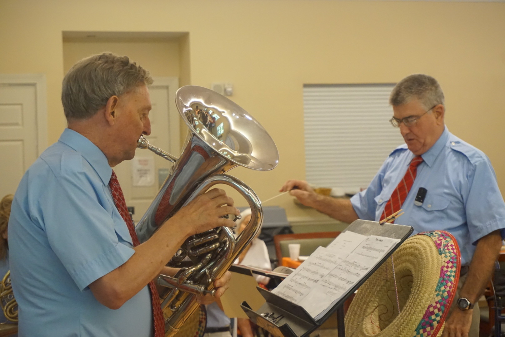 Dr. William McNeiland plays the tuba led by Ancient City Brass Band Co-Founder Cliff Newton
