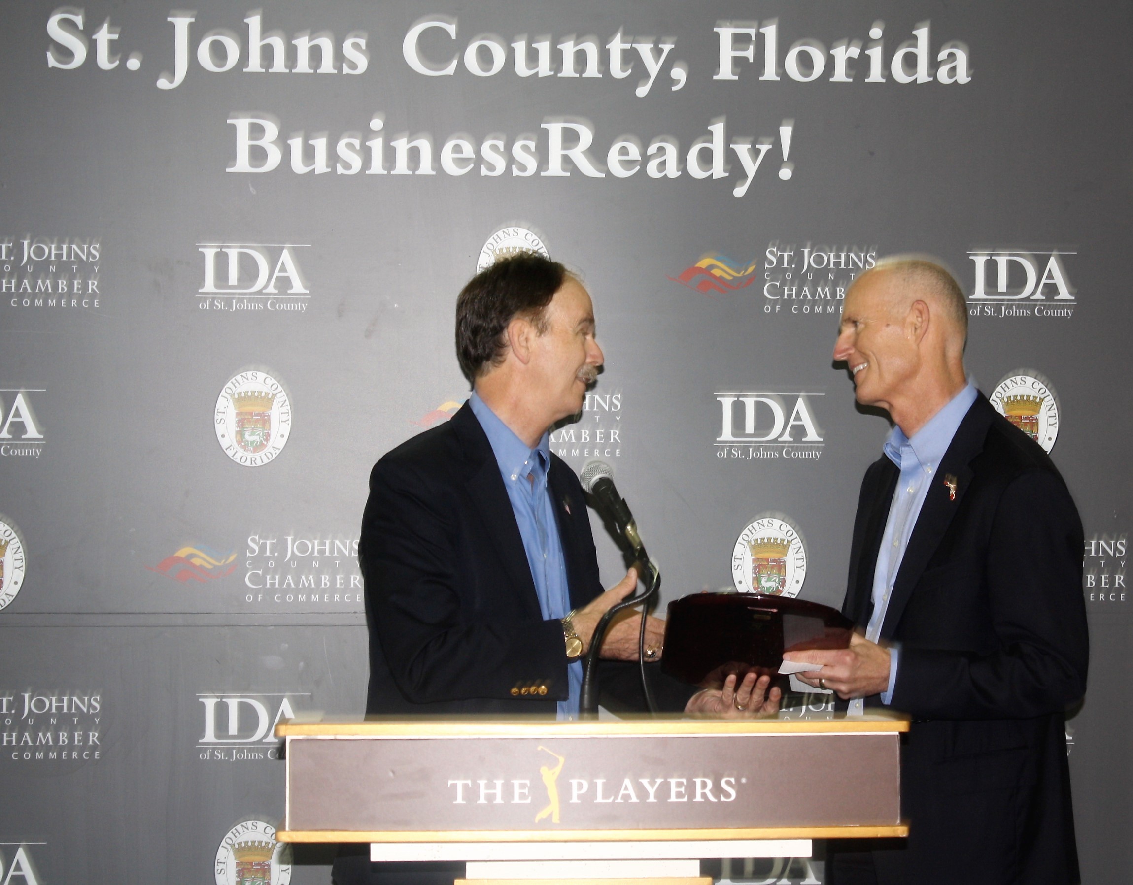 Lake Ray of the First Coast Manufacturers Association presents an award to Gov. Rick Scott
