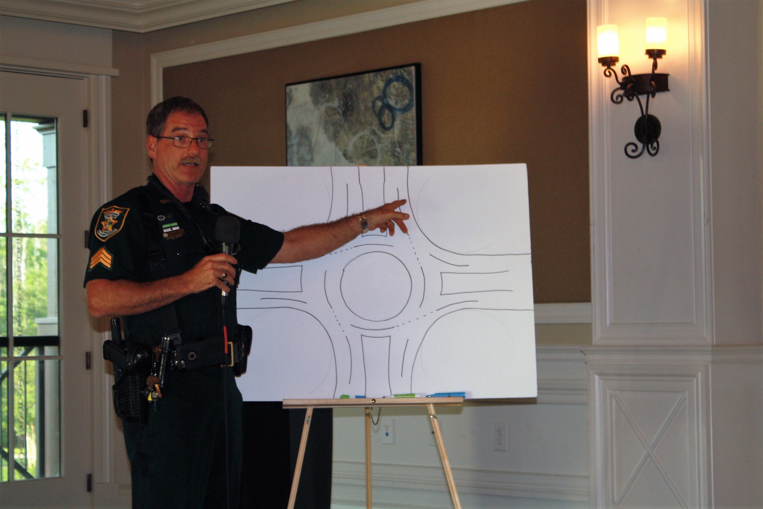 Sgt. Jay Lawing of the St. Johns County Sheriff’s Office explains how to navigate a multiple-lane roundabout.