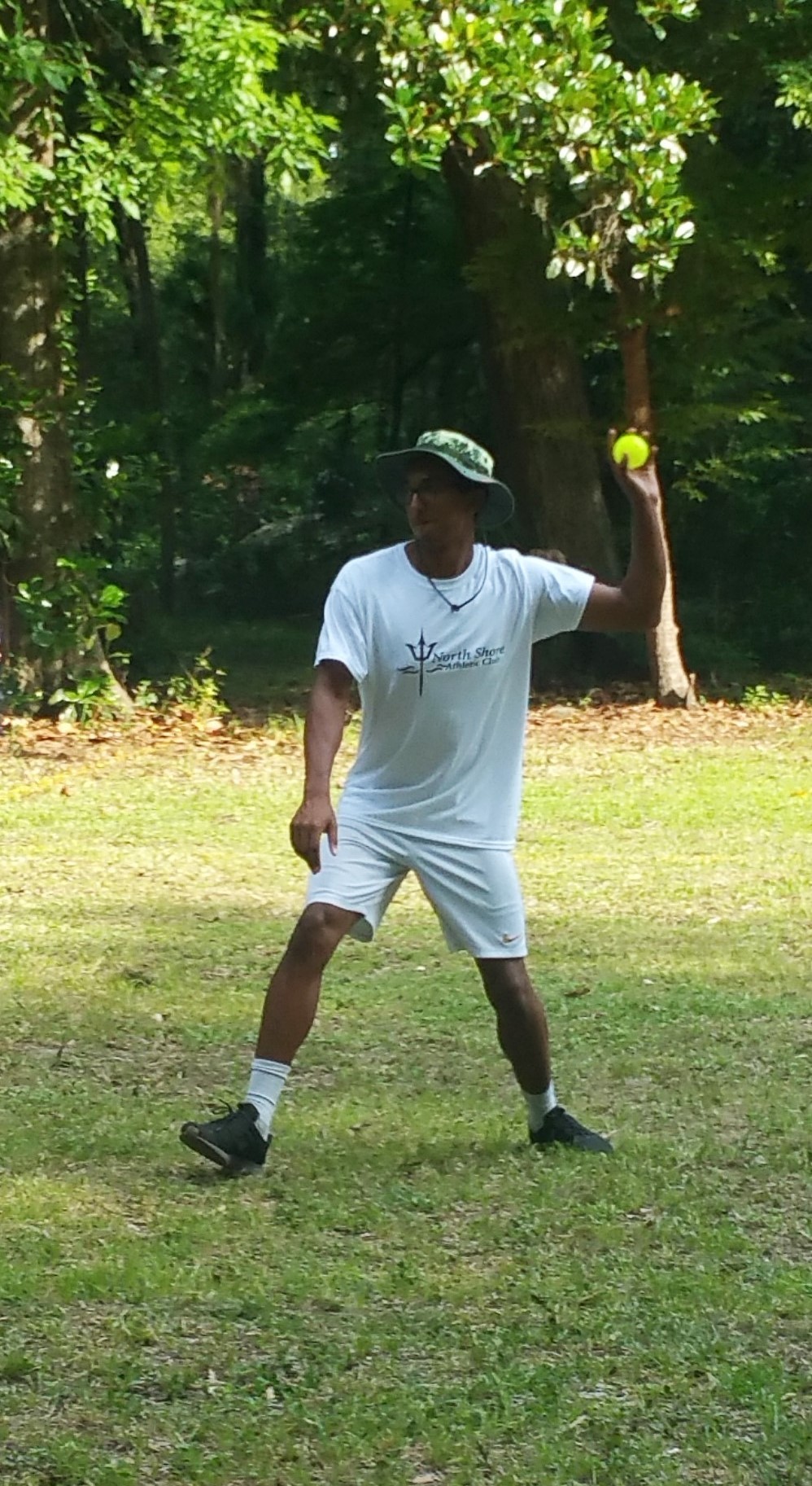 Counselor Jordan Walker pitches in a game of baseball