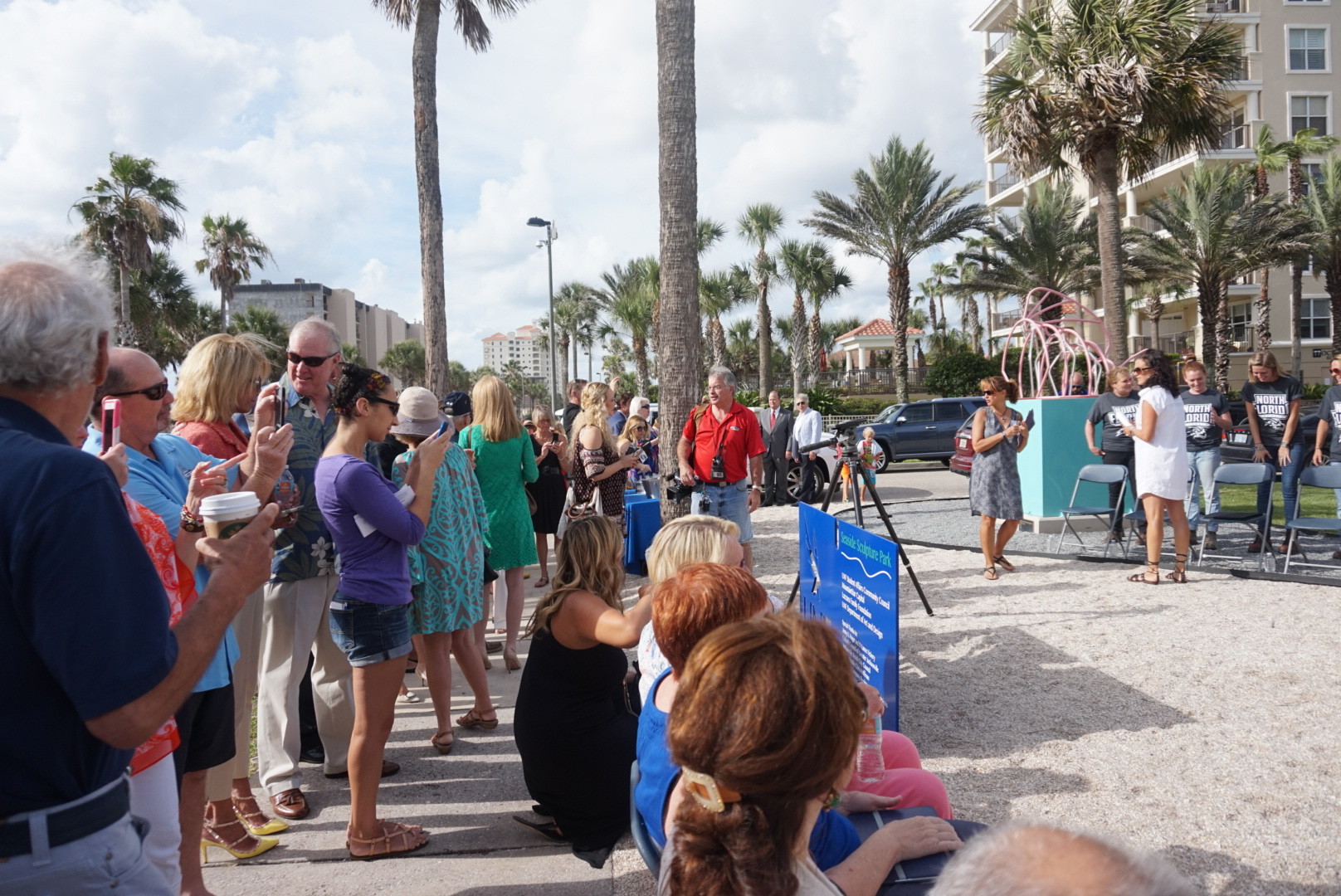 A crowd quickly forms at the grand opening of UNF’s Seaside Sculpture Park