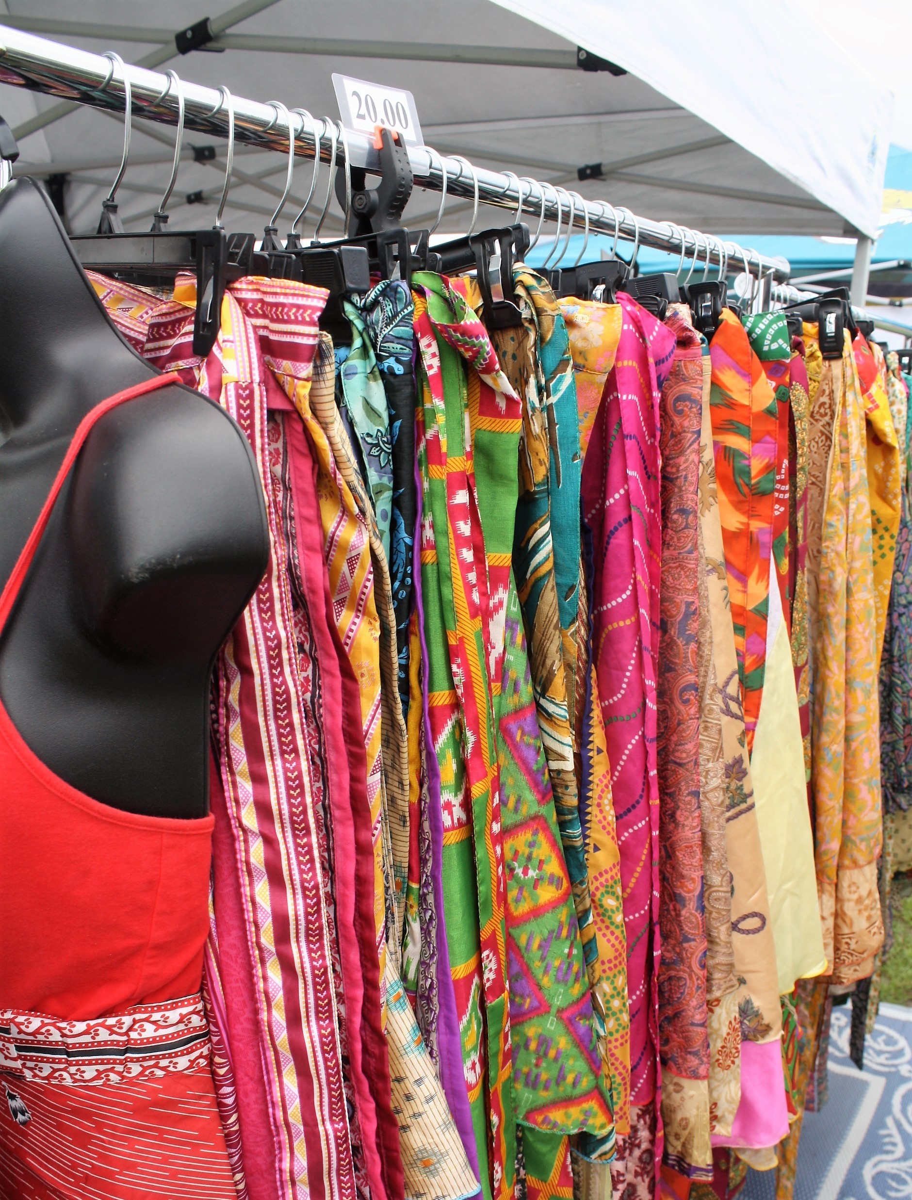 Colorful sarongs and beachwear were among the offerings at the farmer’s market.