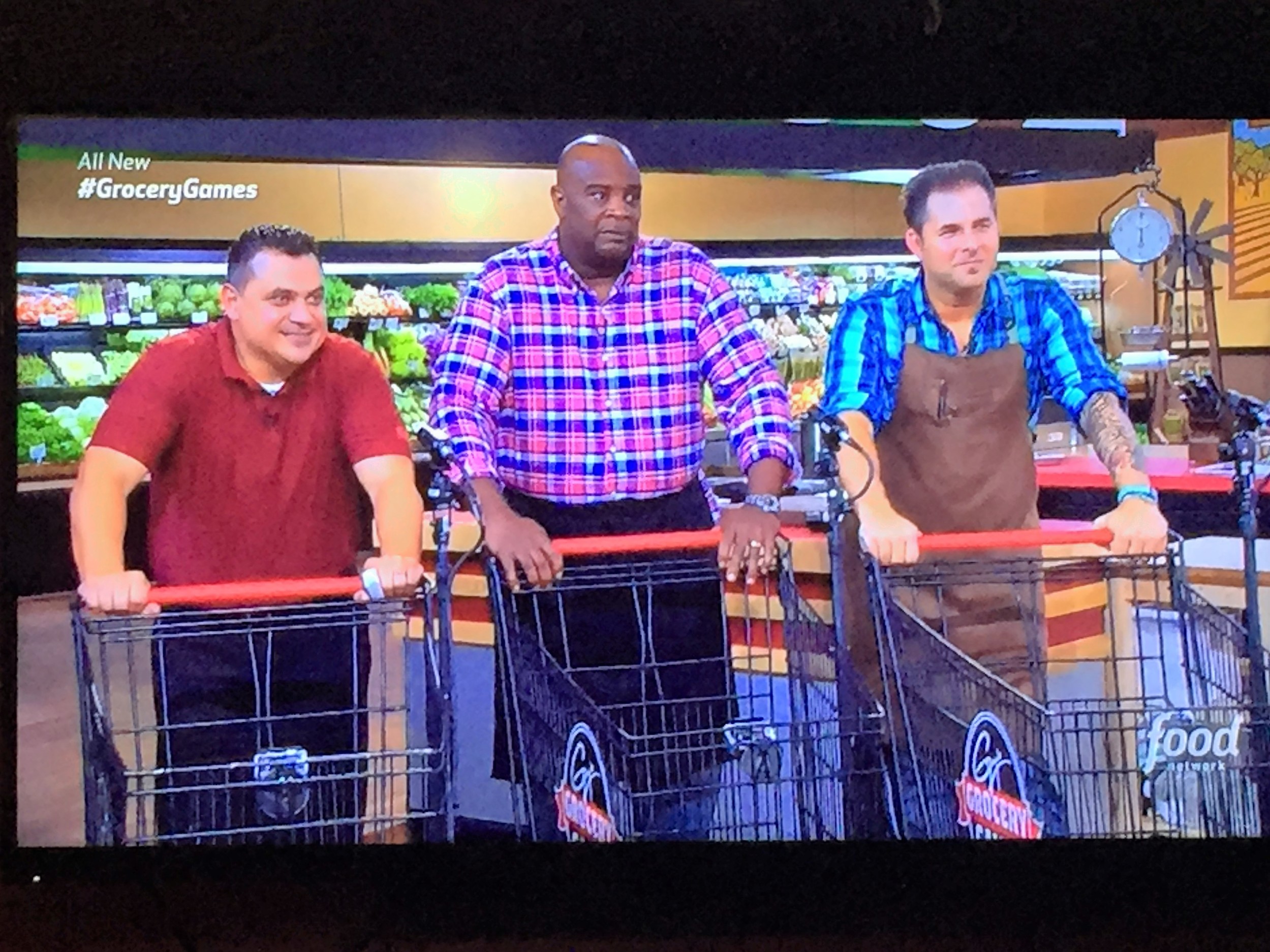 Executive Chef DeJuan Roy (center) competes on Guy Fieri's Grocery Games.