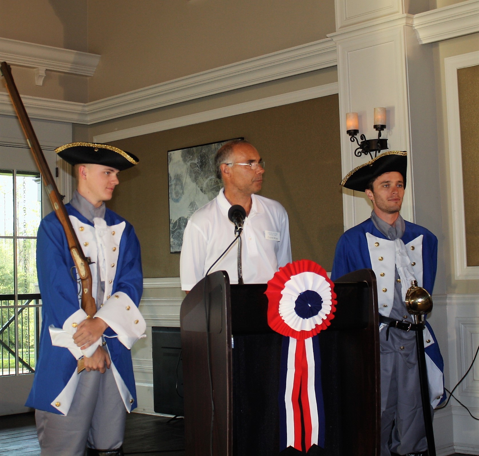 Nocatee community manager David Ray, flanked by two colonial soldiers, thanks residents for attending the patriotic celebration.