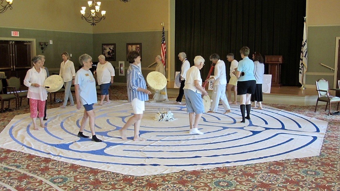 Fleet Landing residents make their way through a labyrinth