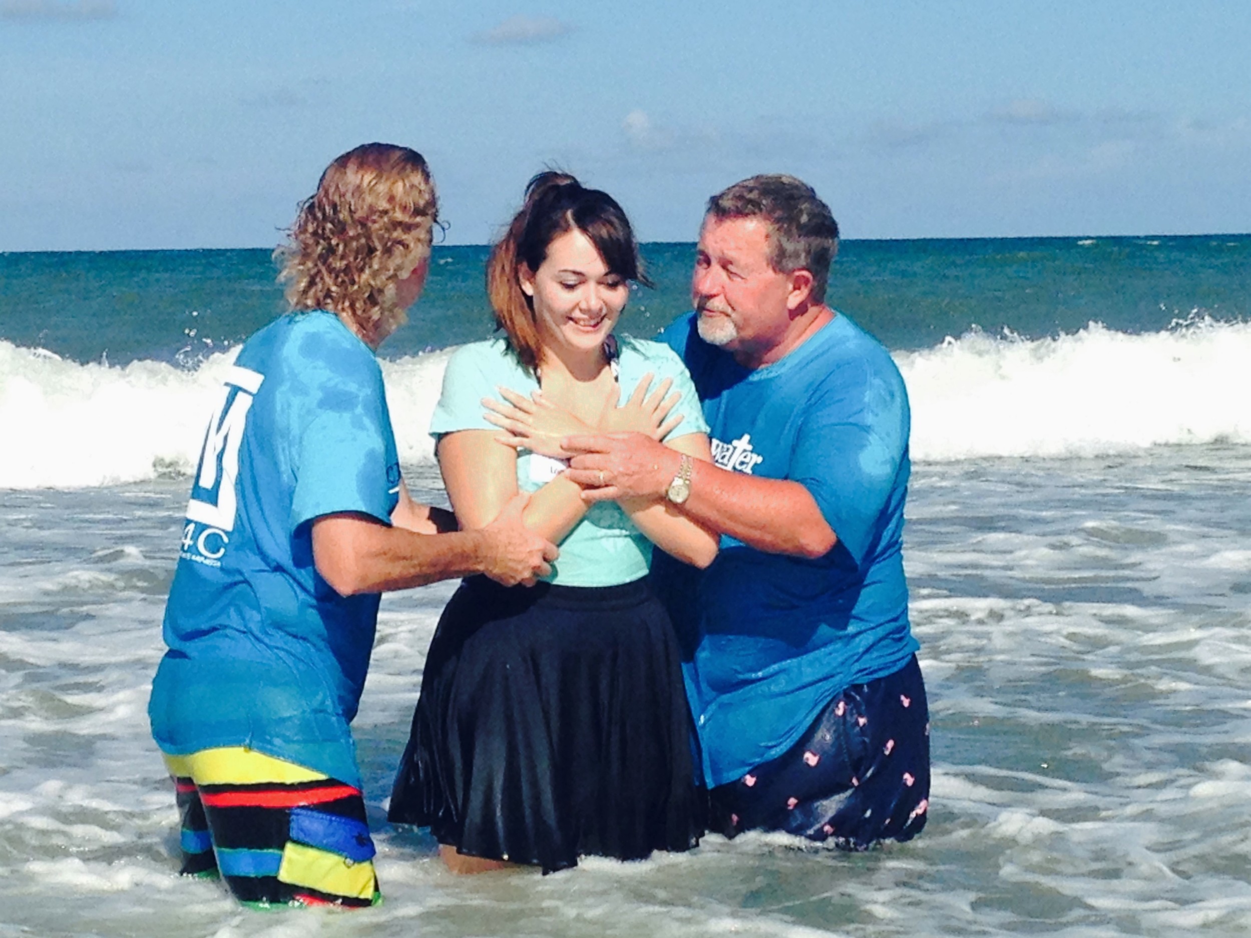 Adult Pastor George Powers and Lead Pastor Jack Millwood prepare to baptize Samantha Logue.