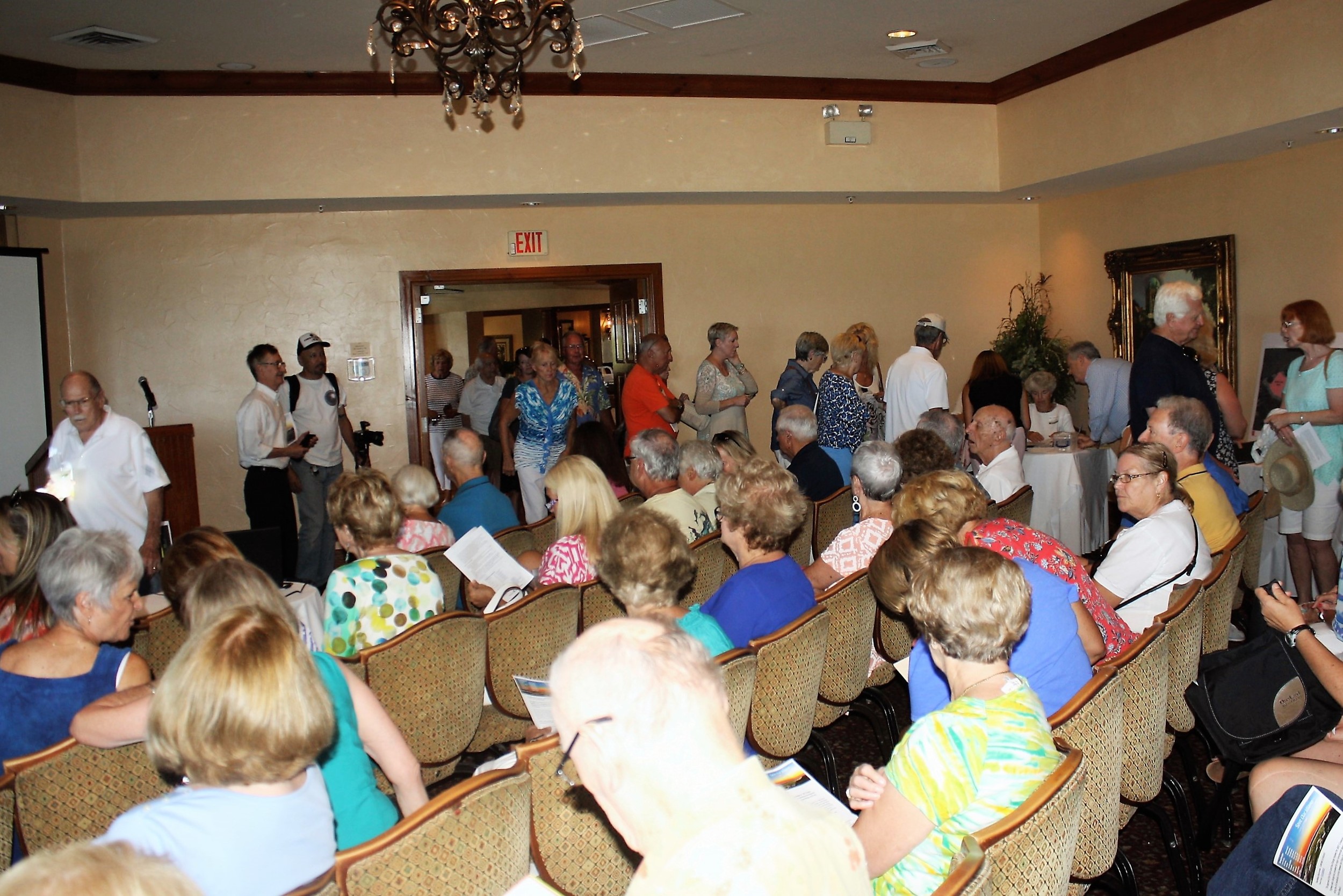 Local residents stream into Serenata Beach Club to learn more about a proposal to build a large hotel, conference center and commercial development on Coastal Highway in Vilano Beach.
