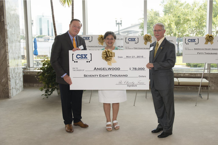 CSX presents a check representing the proceeds from the Charity Train Ride