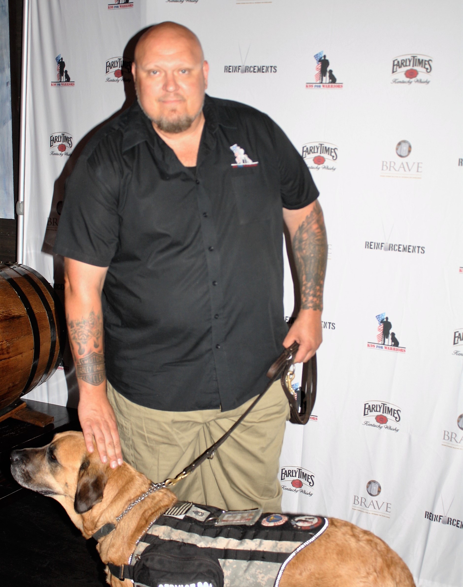 Veteran Joe Swoboda and his service dog Lilly attend the private screening of Reinforcements