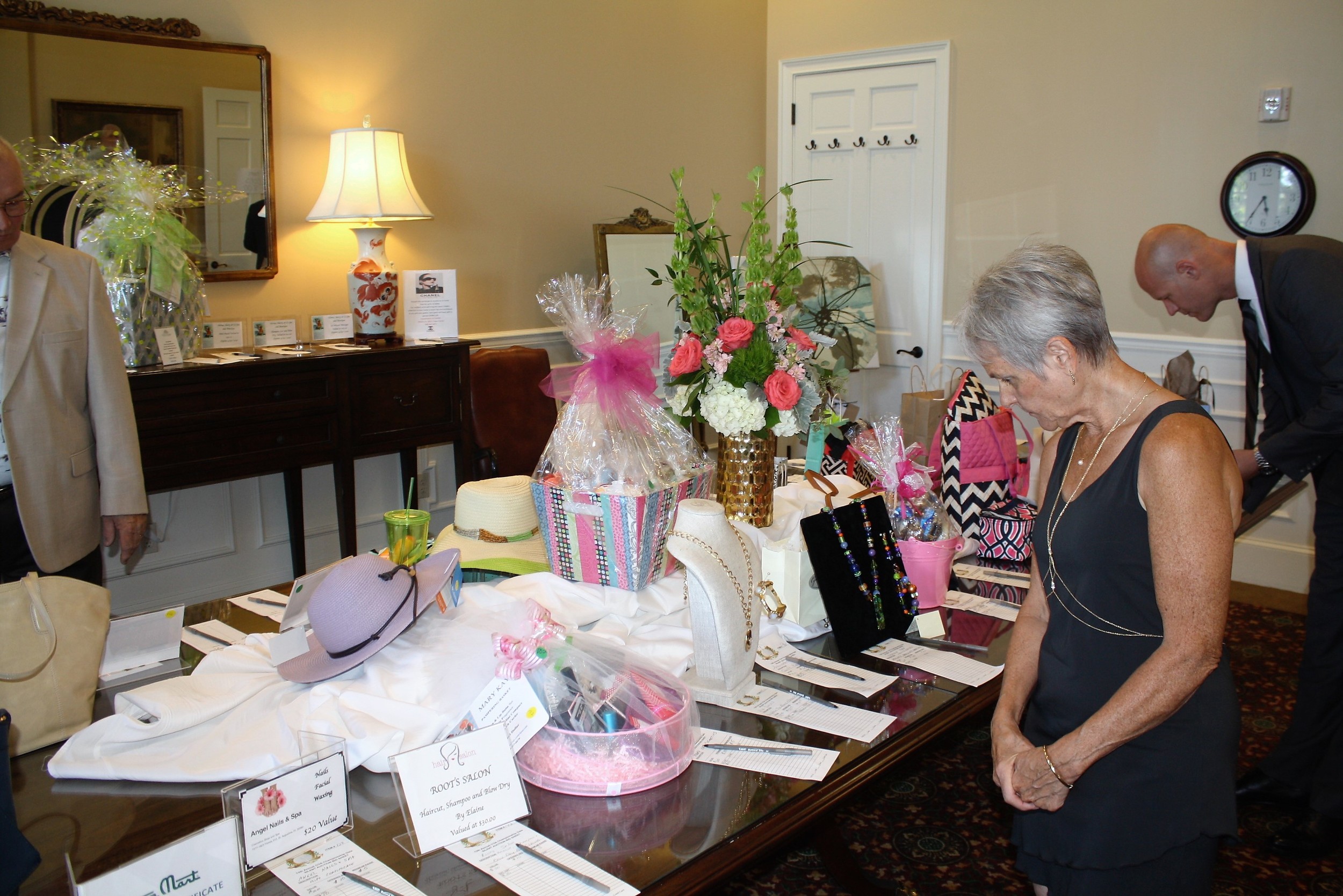 Guests peruse the silent auction offerings