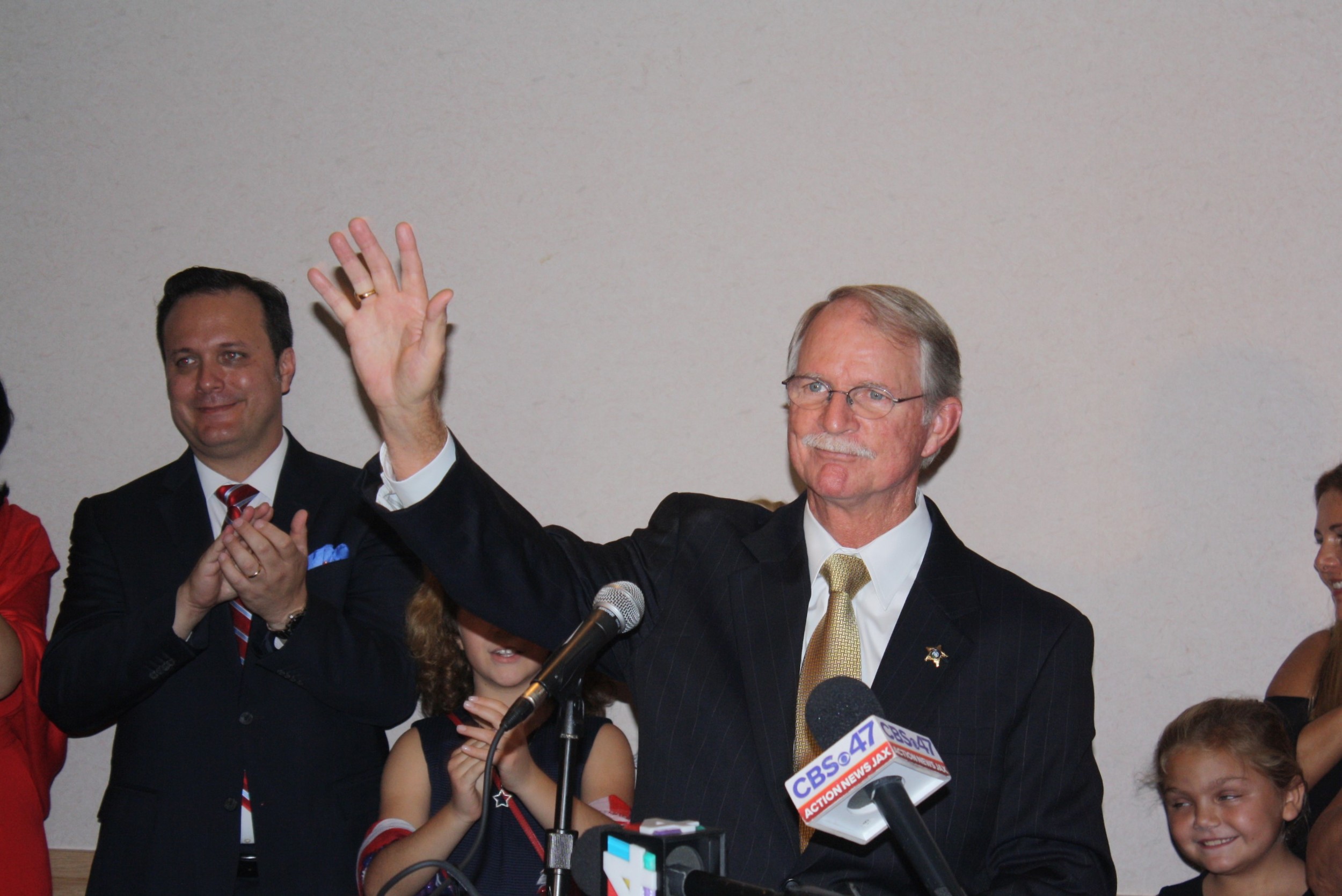 Former Jacksonville Sheriff John Rutherford acknowledges the cheers of supporters following his election victory in the Republican primary for the 4th congressional district.