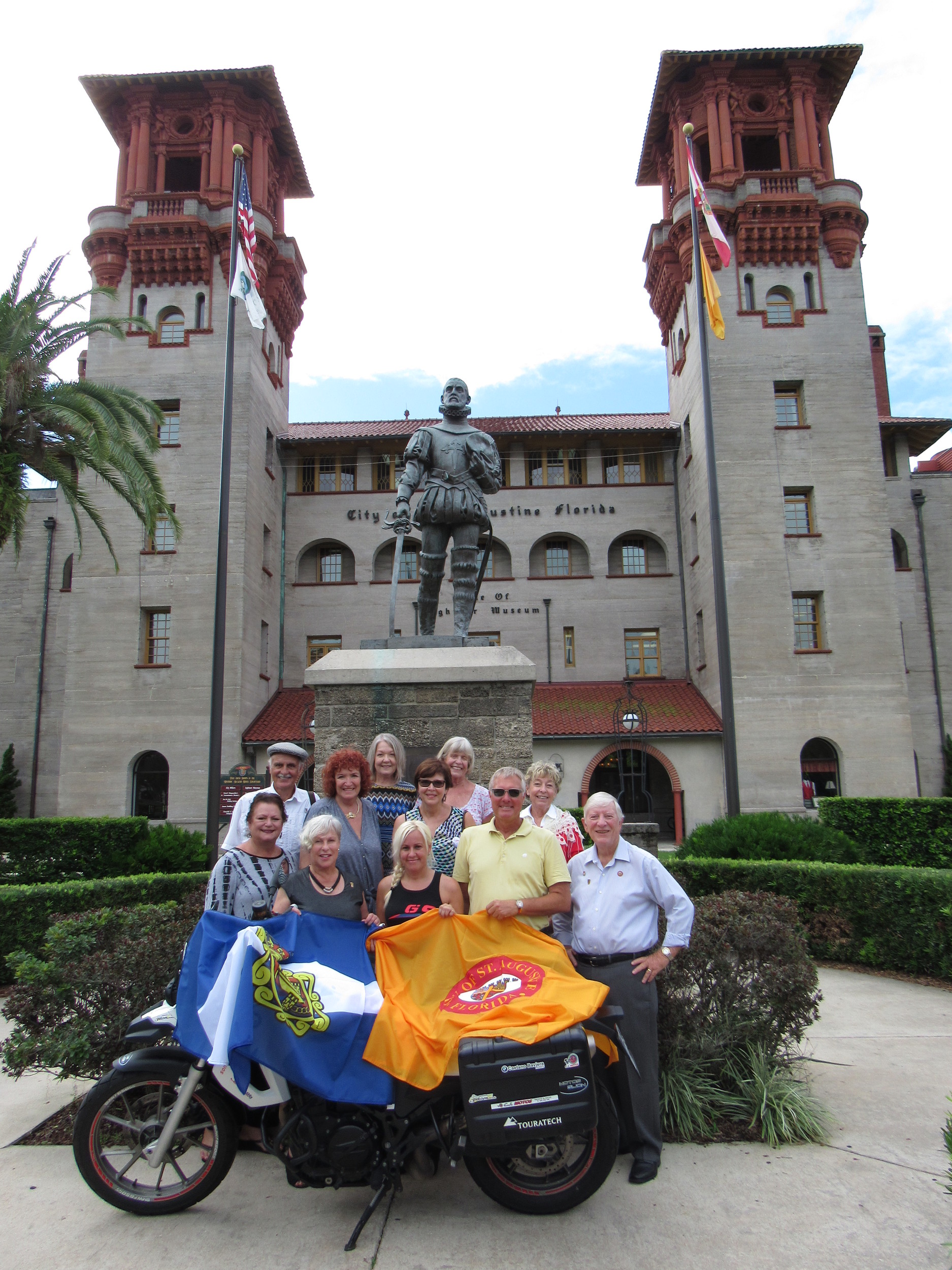 St. Augustine Mayor Nancy Shaver (left) and Sonia Barbosa of Aviles, Spain (right) pose with members of the flag commission.