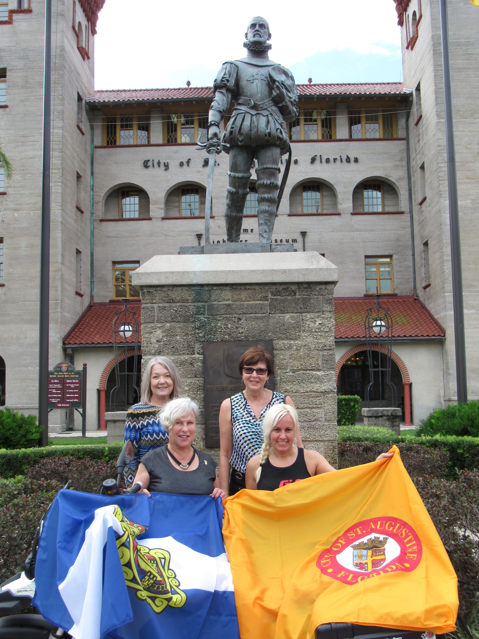 Sonia Barbosa of Aviles poses with St. Augustine Mayor Nancy Shaver and members of the city commission after the flag exchange ceremony. Barbosa had her motorcycle shipped to New York City and rode it down to St. Augustine for the Aug. 26 ceremony.