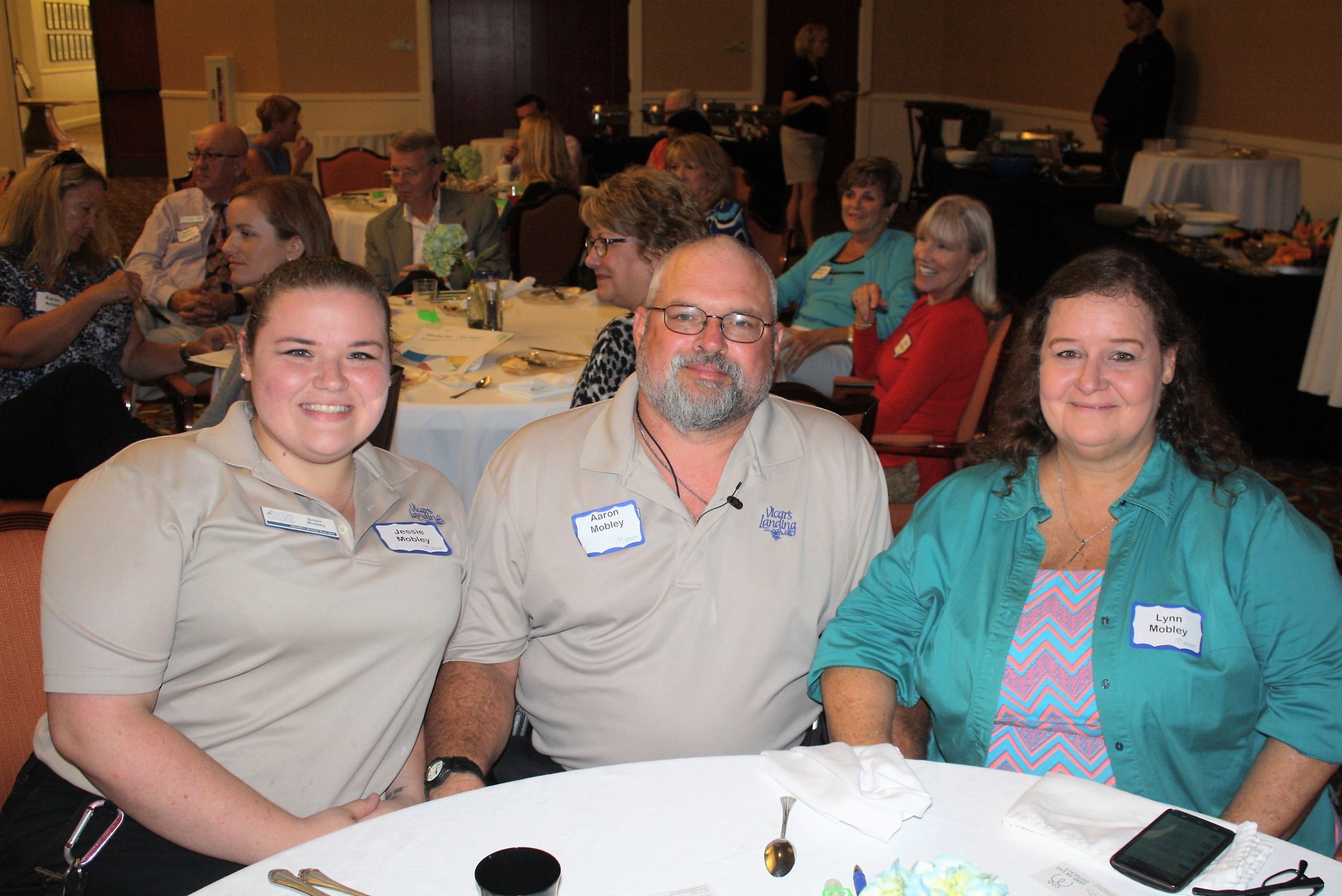 Vicar’s Landing Senior Security Officer Aaron Mobley – shown here with daughter Jessie and wife Lynn – was instrumental in forging the partnership between Vicar’s Landing and Lend an Ear Outreach, which provided him with much-needed hearing aids.