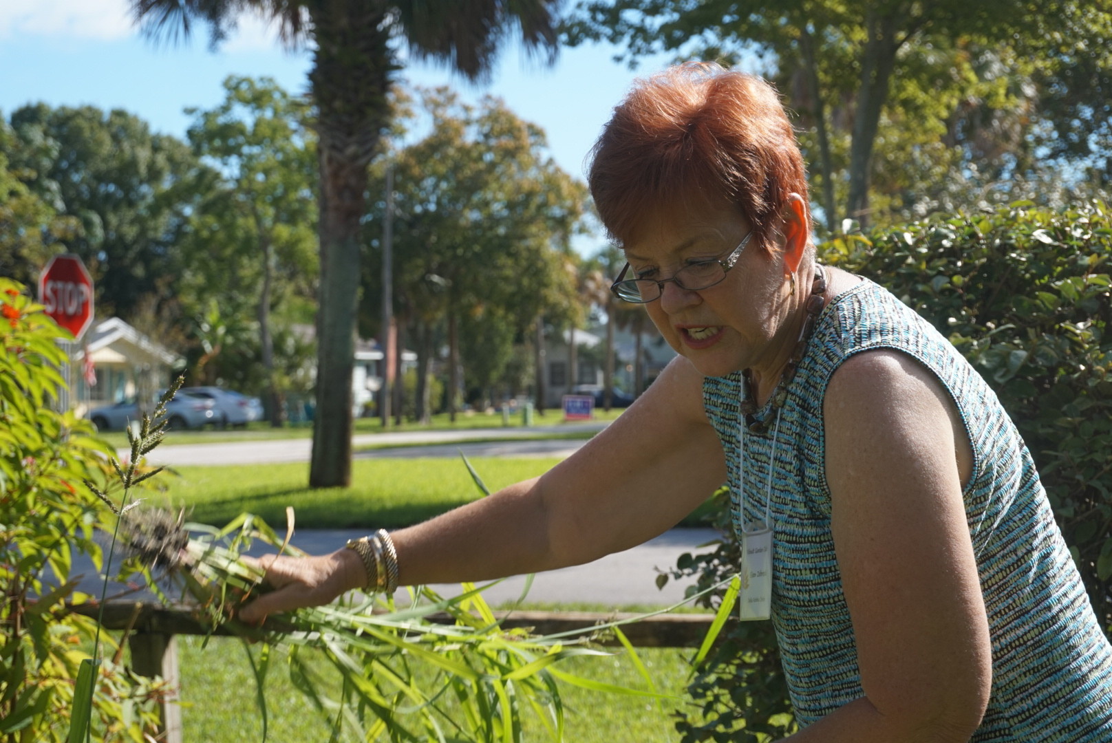 Youth Garden Coordinator Eileen Zebroski does quick upkeep pulling weeds in the garden