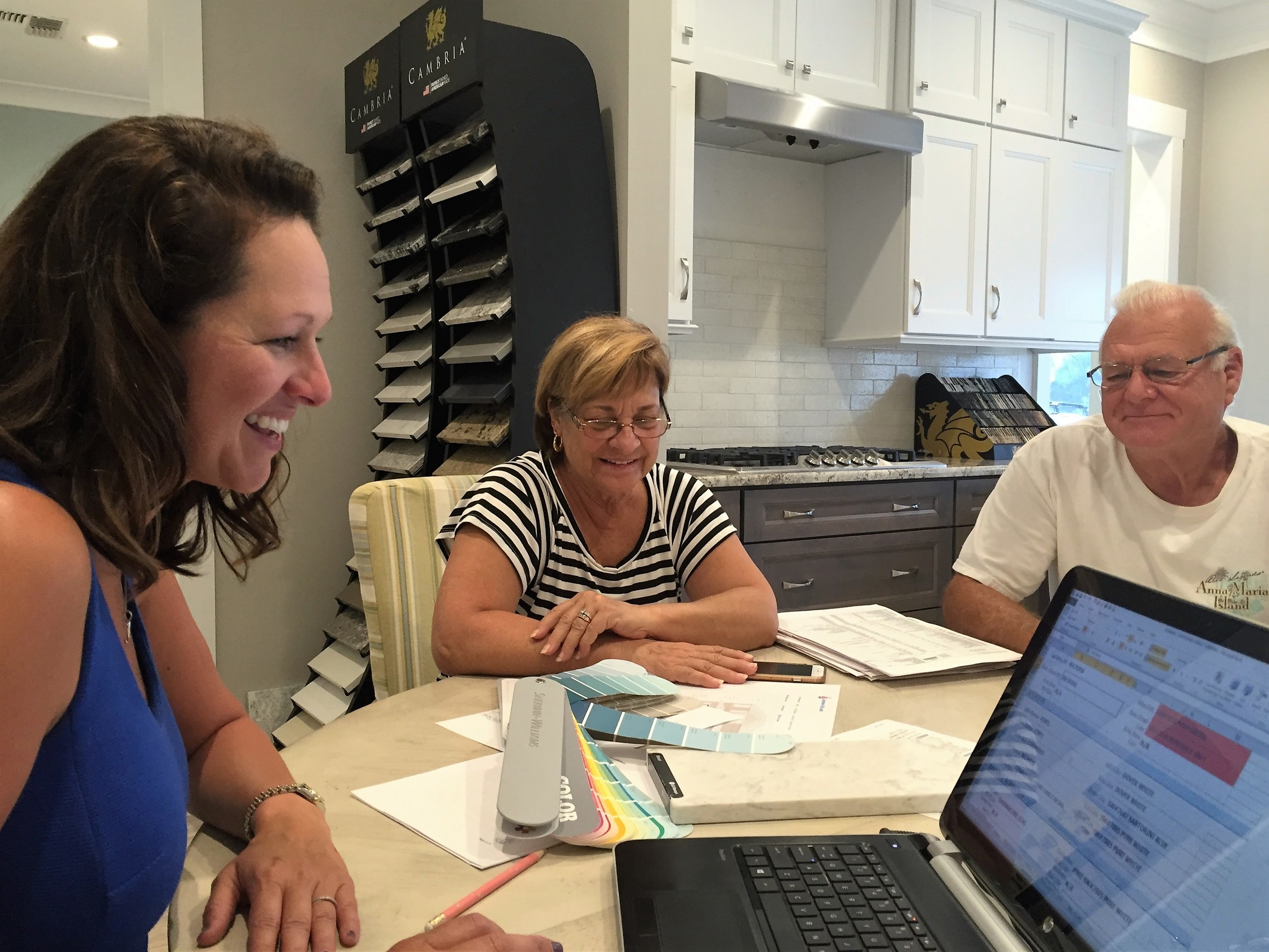 Josie Myers (left ) works with Carol and John Durant at the Generation Homes Design Center in St. Augustine Beach.