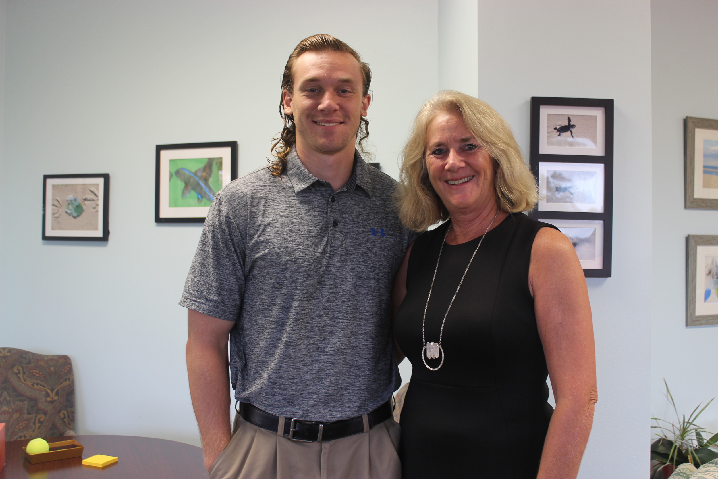 Taylor Rush with his mother, Bolles Lower School Ponte Vedra Beach Campus Head and breast cancer survivor Peggy Campbell-Rush. Rush previously donated his hair to an organization that makes wigs for cancer patients and is growing his hair out again to donate a second time.