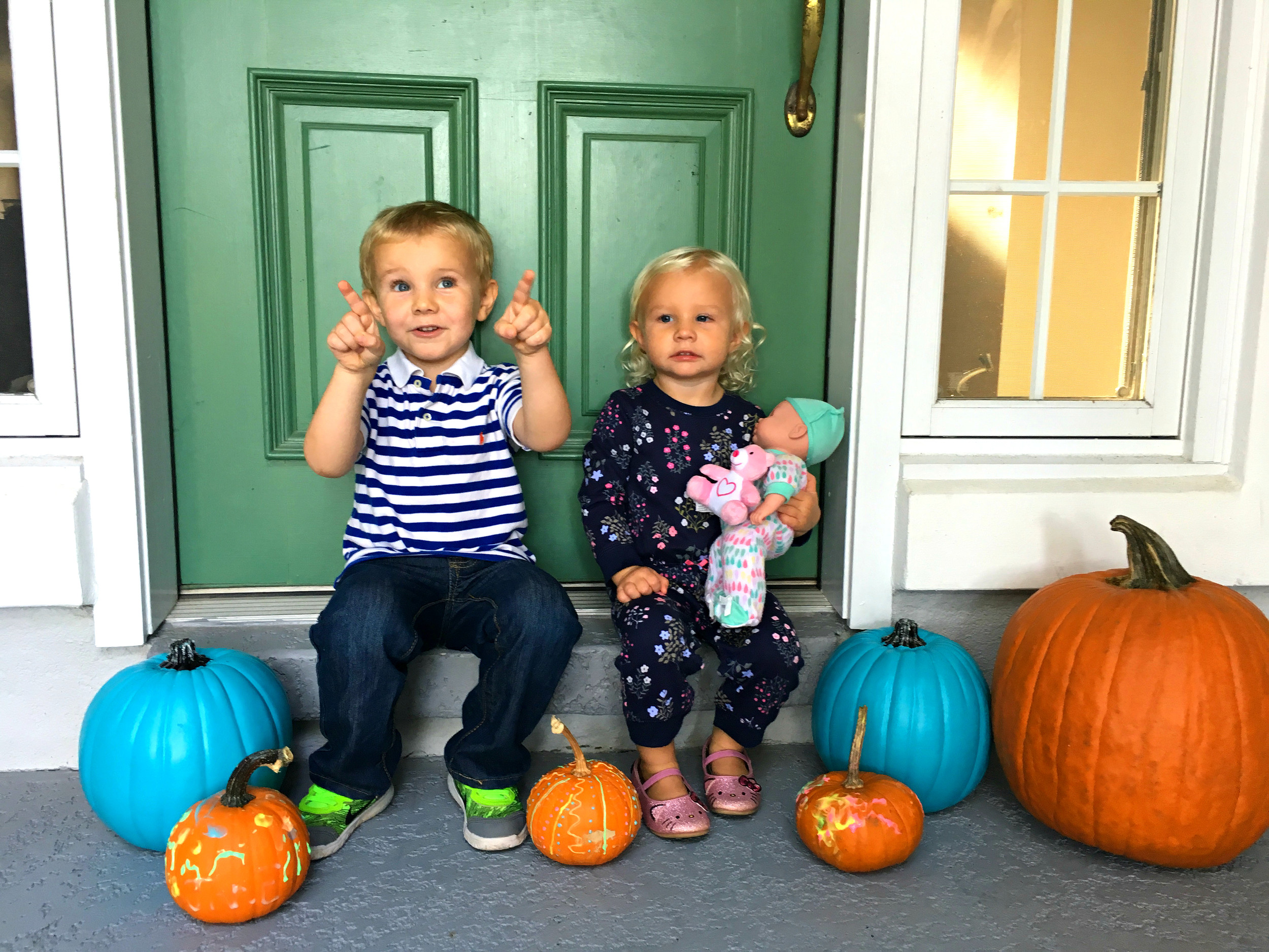 Jake and Abby with teal pumpkins