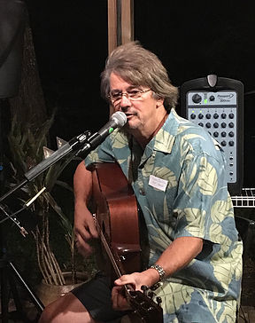 Save Guana Now co-founder Gary Coulliette sings and plays guitar at the fundraiser.