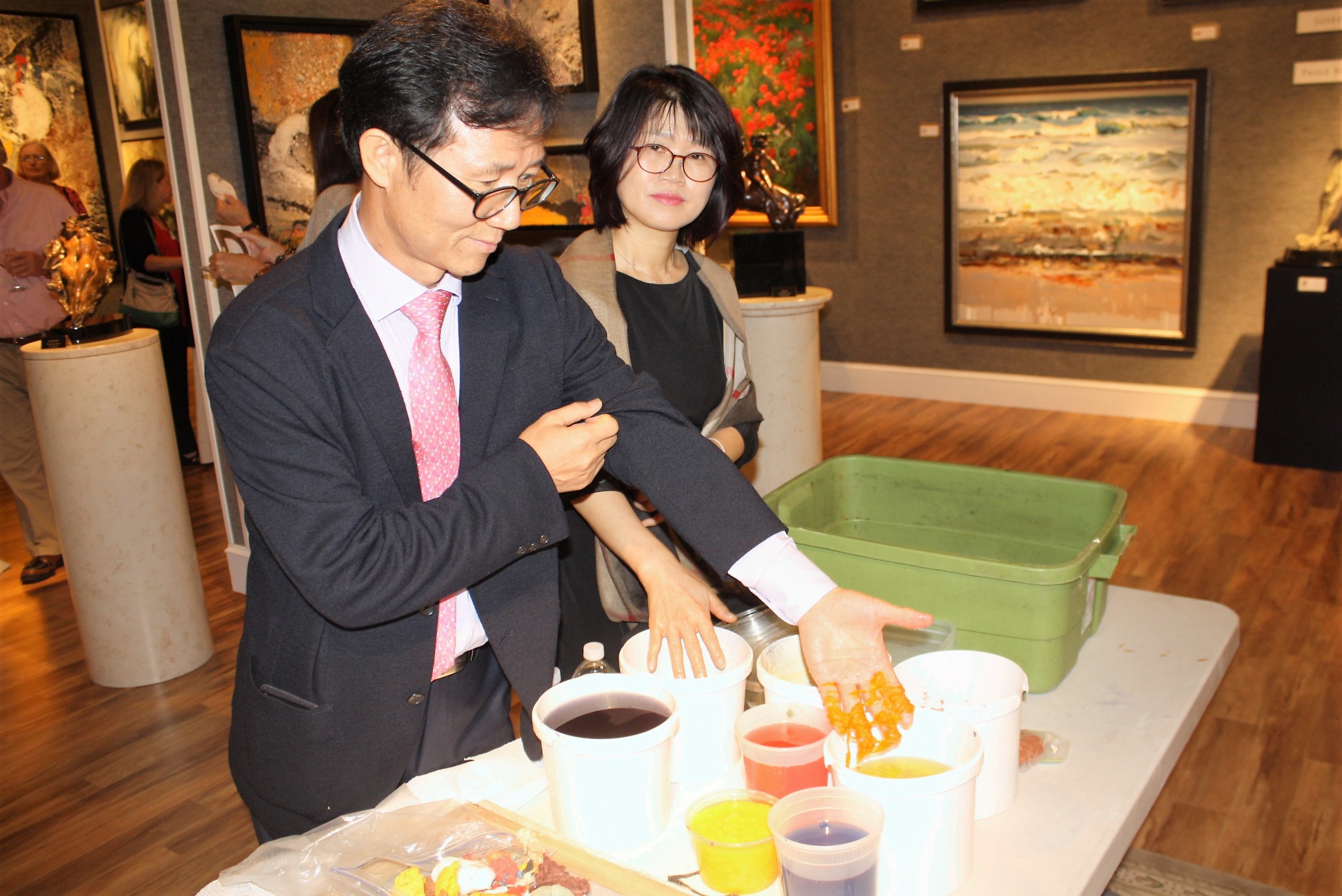Jeong Yun displays some of the handmade organic fibers he creates to make paper tapestries.