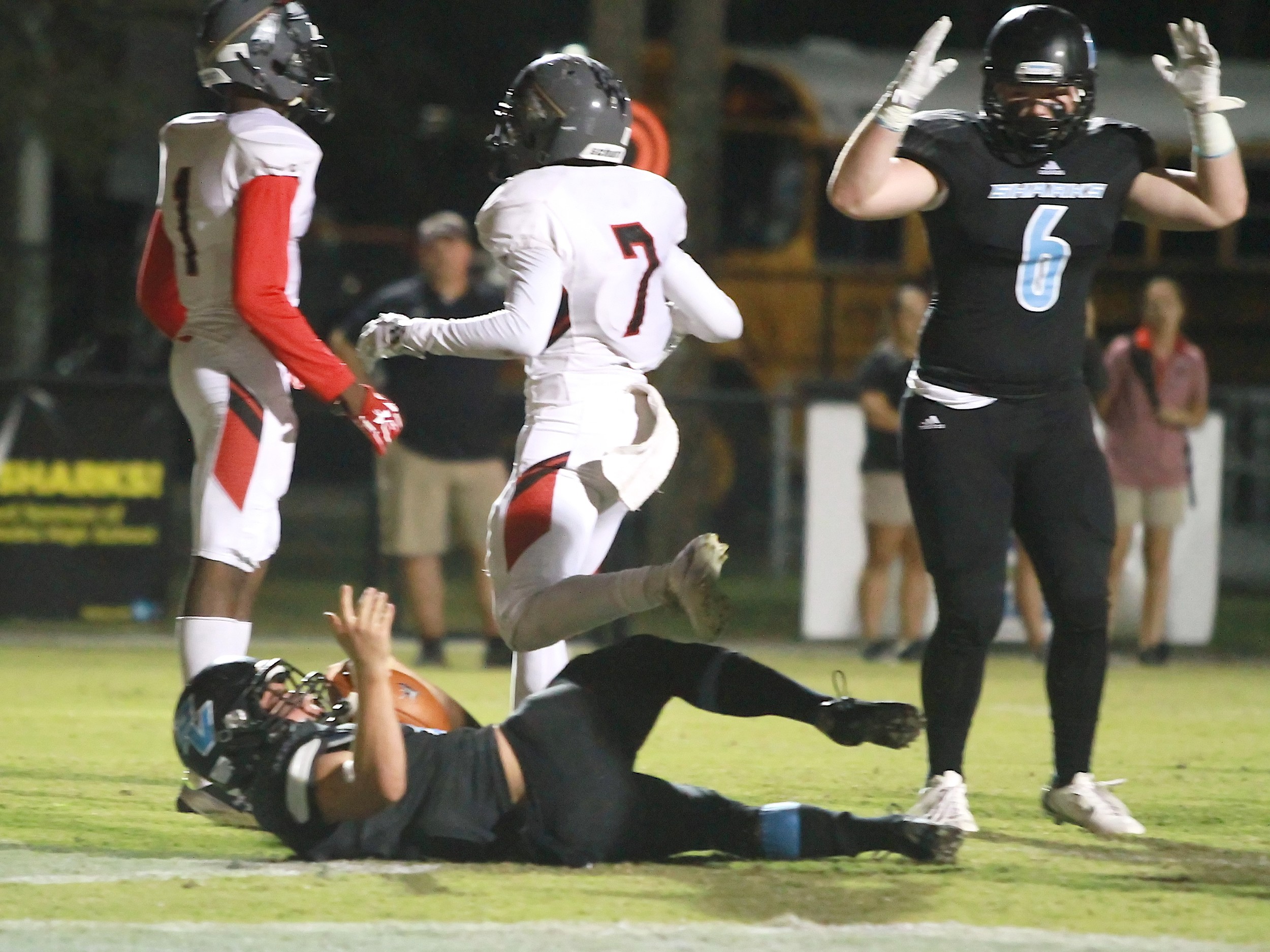Hal Swan scores for the Sharks as #6 Gibson Pardue celebrates