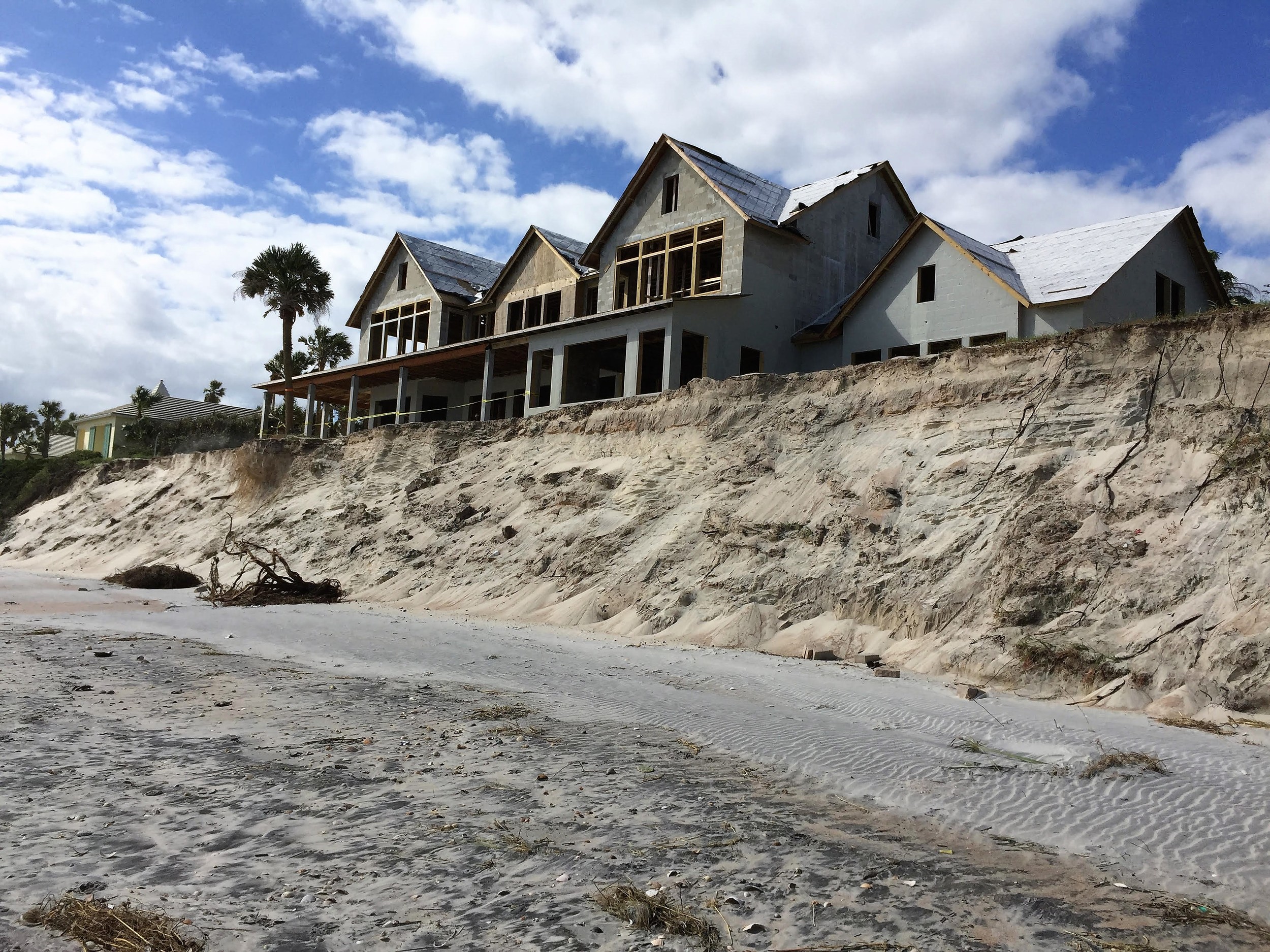A new home on Ponte Vedra Boulevard sits perilously close to the edge of the dunes following Hurricane Matthew.