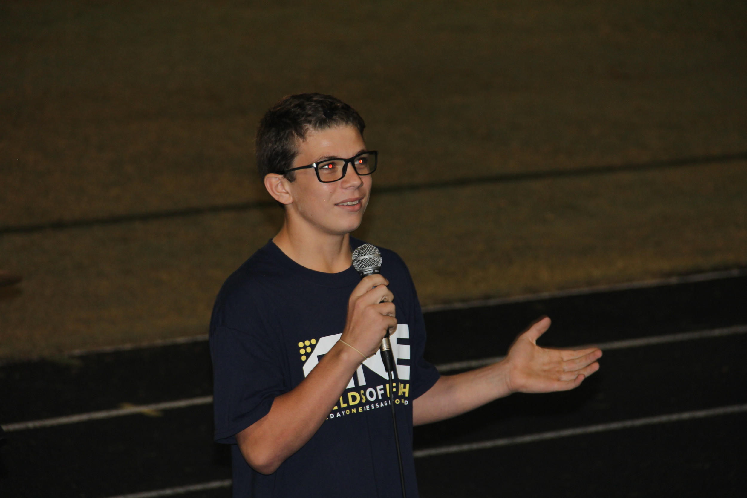 St. Augustine High School freshman Ethan Swindle shares his testimony at Fields of Faith.